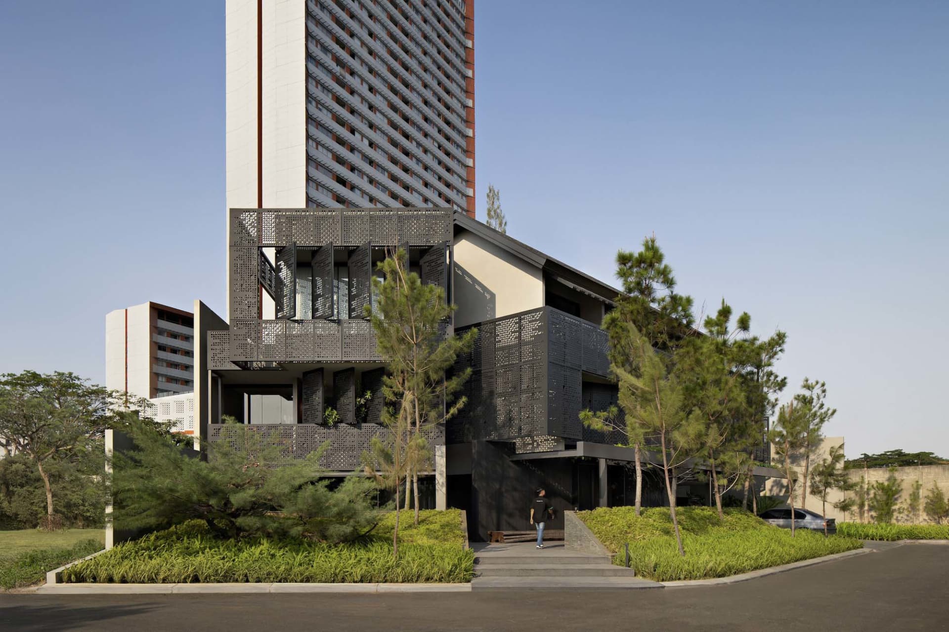Modern office building with black metal cladding and glass façade exterior