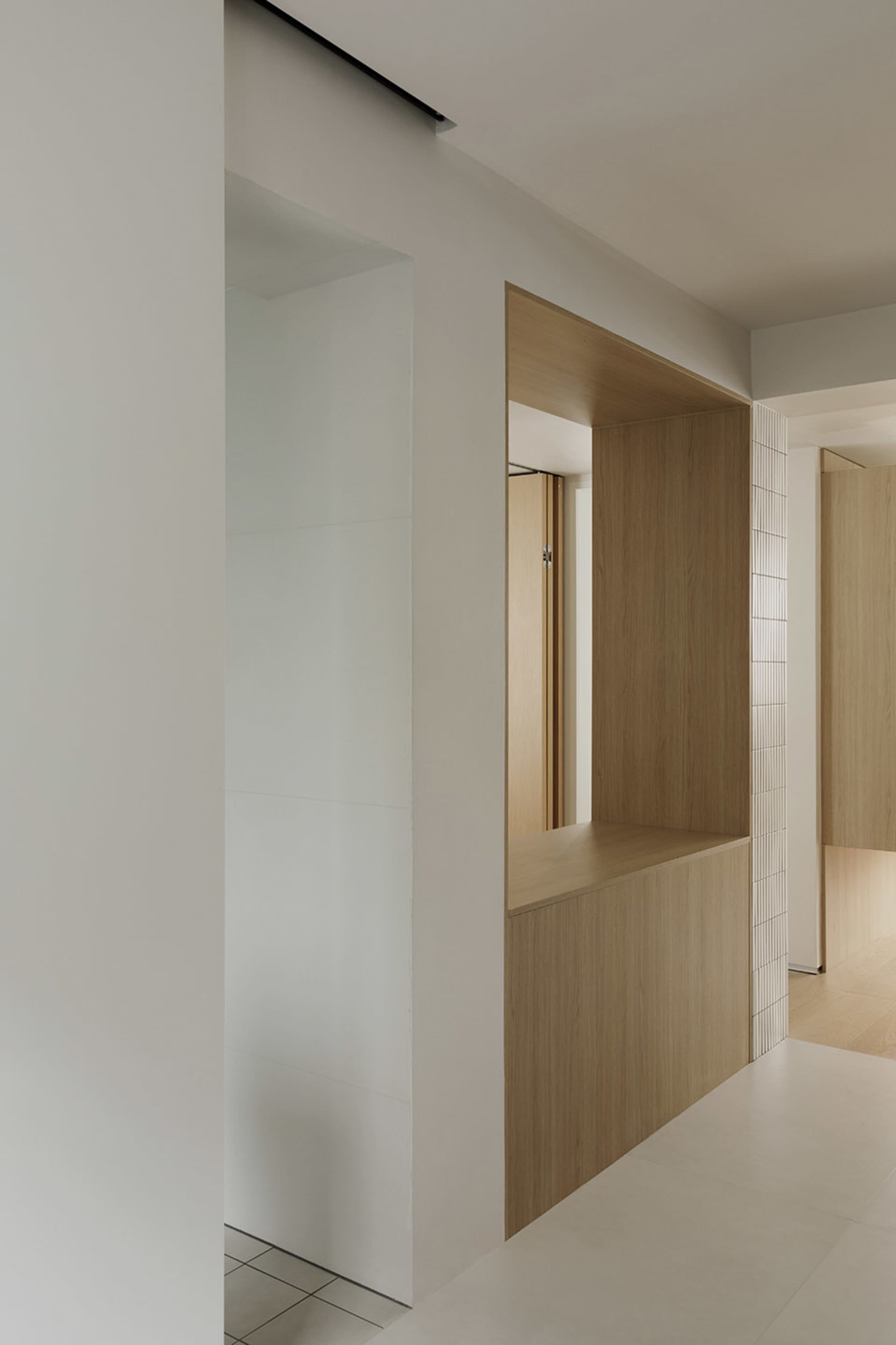 Minimalist room featuring wooden furniture.