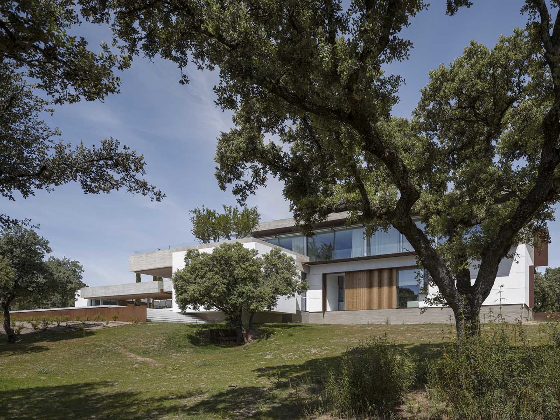 Modern residential building featuring a concrete and glass exterior