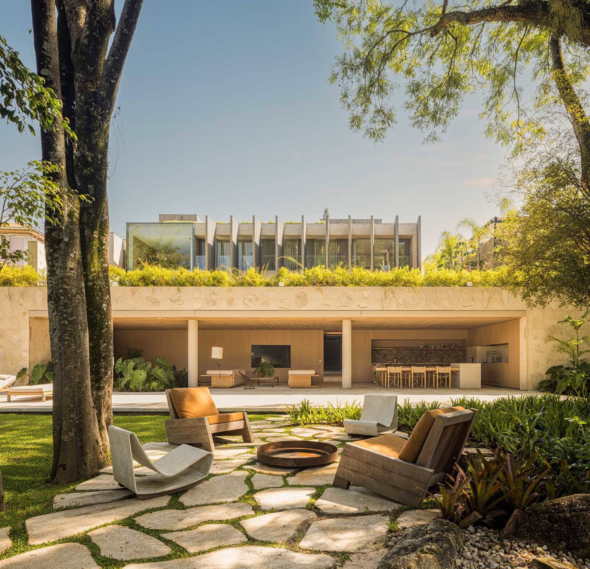 Modern residential exterior with concrete roof and landscaped garden
