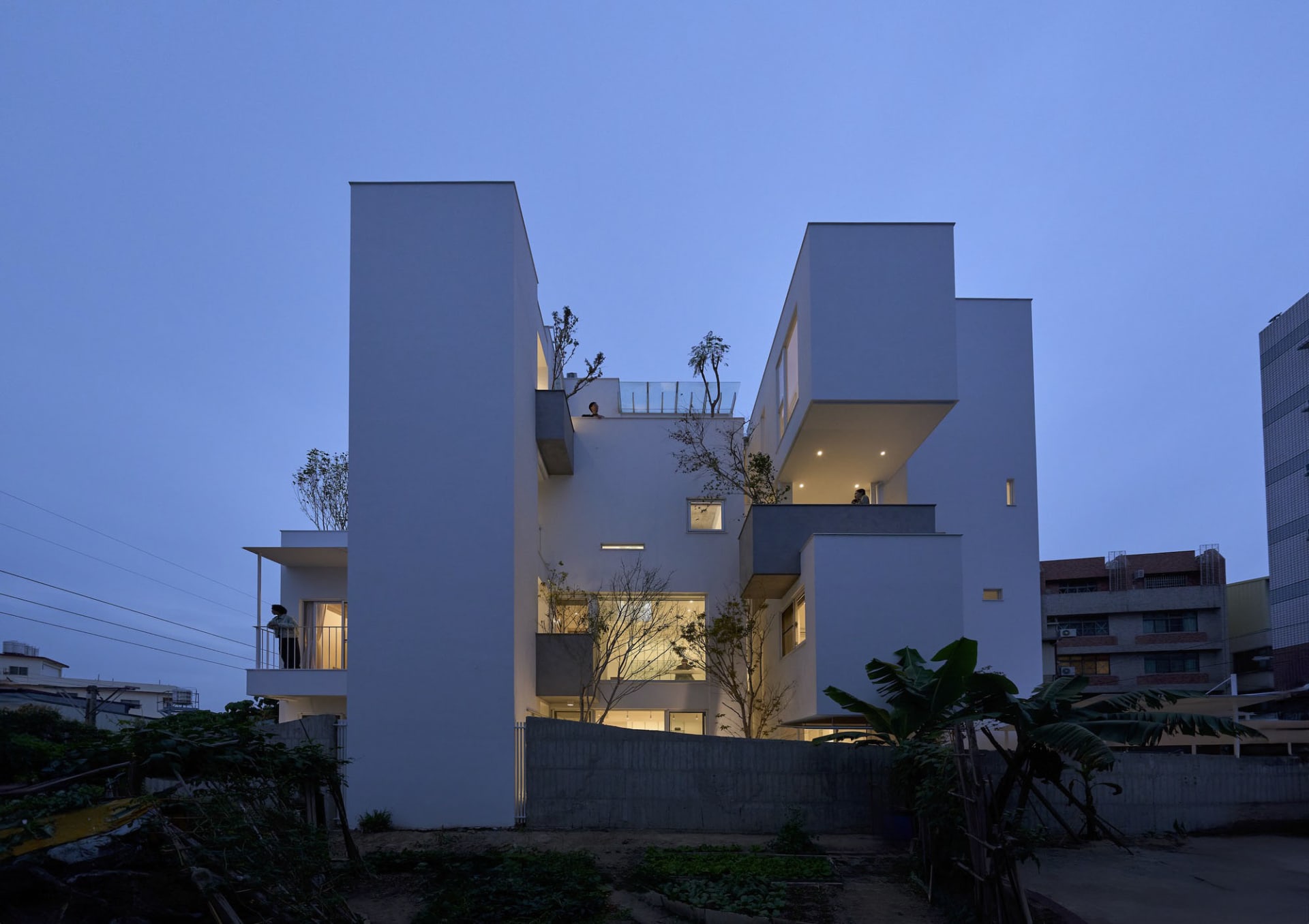A modern residential building constructed primarily of concrete.