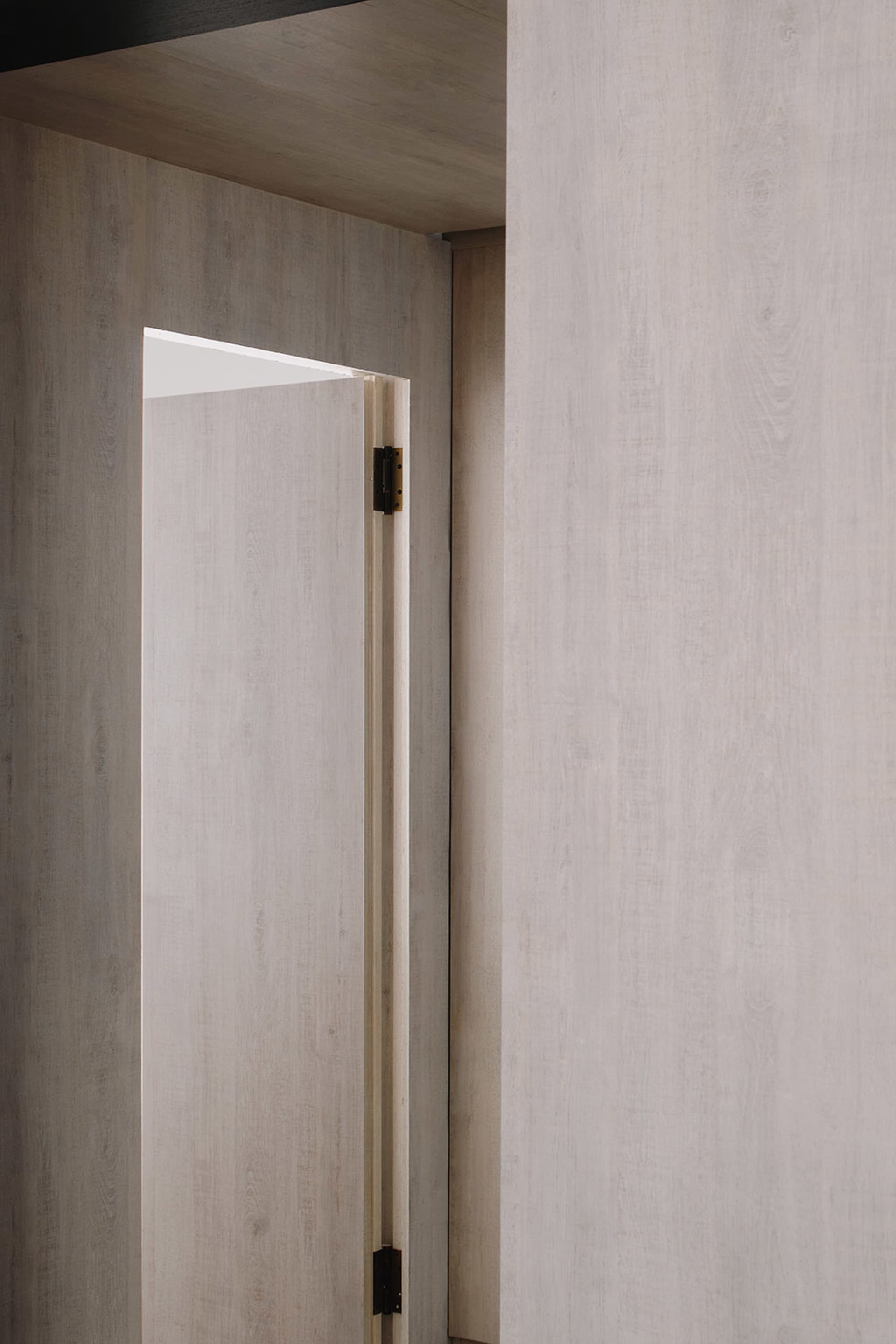 Modern minimalist interior design featuring wooden walls.