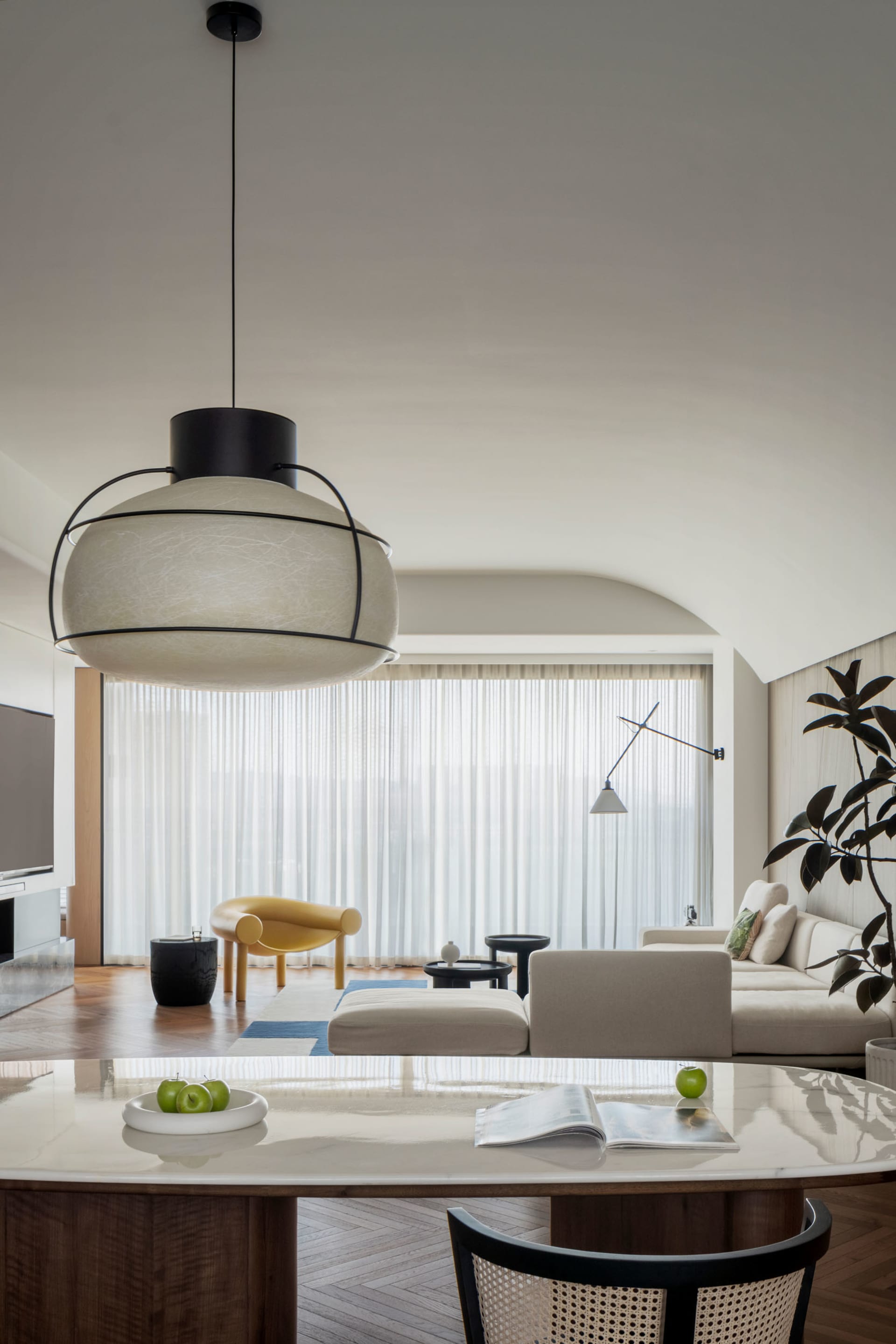 A minimalist living room featuring neutral tones and modern furniture.