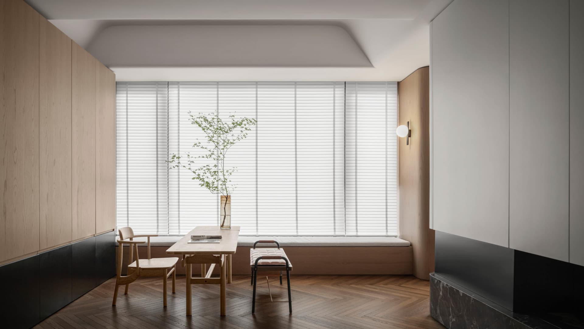 Modern minimalist living room featuring wooden furniture and white blinds.