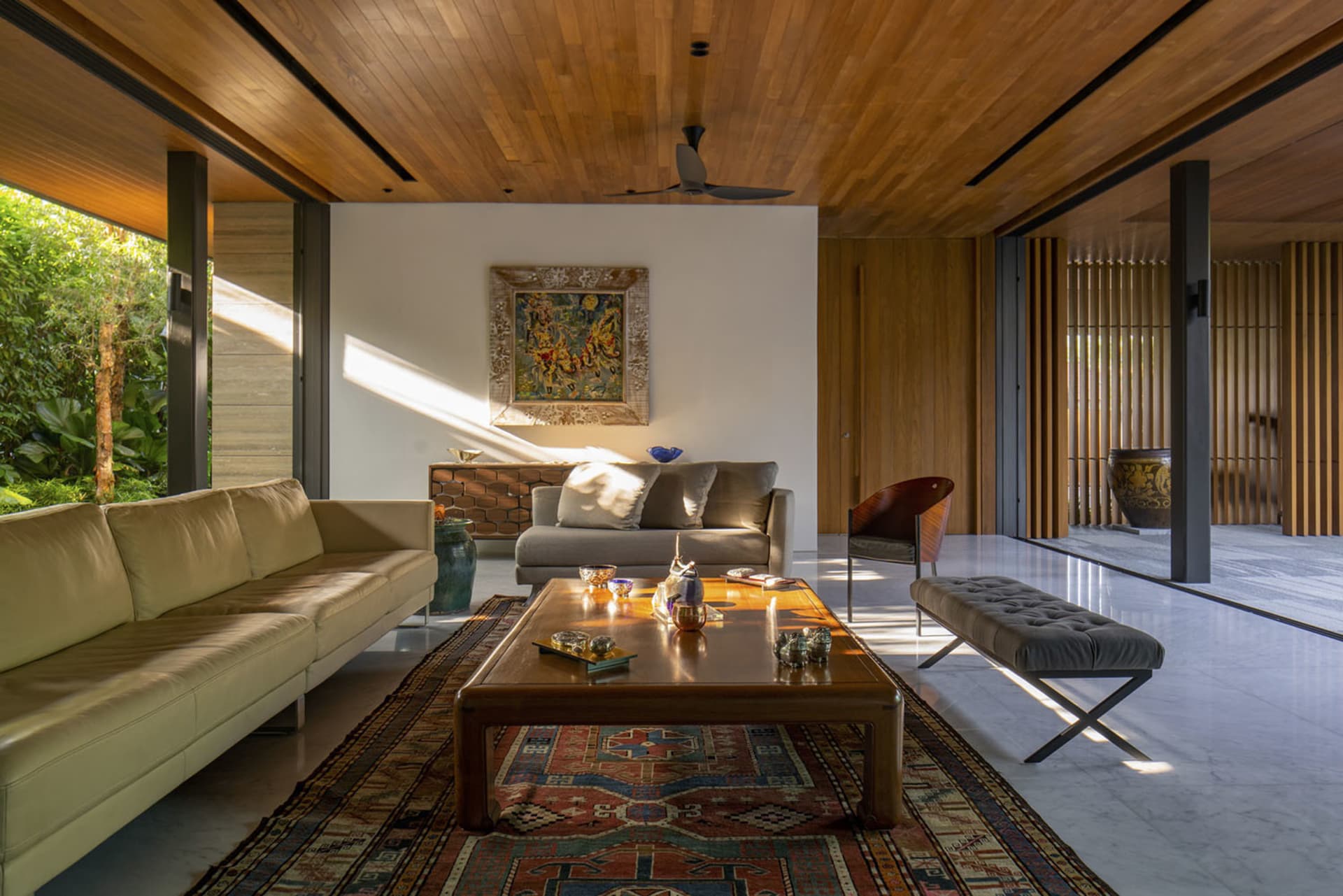 Modern living room with wooden furniture and a patterned rug