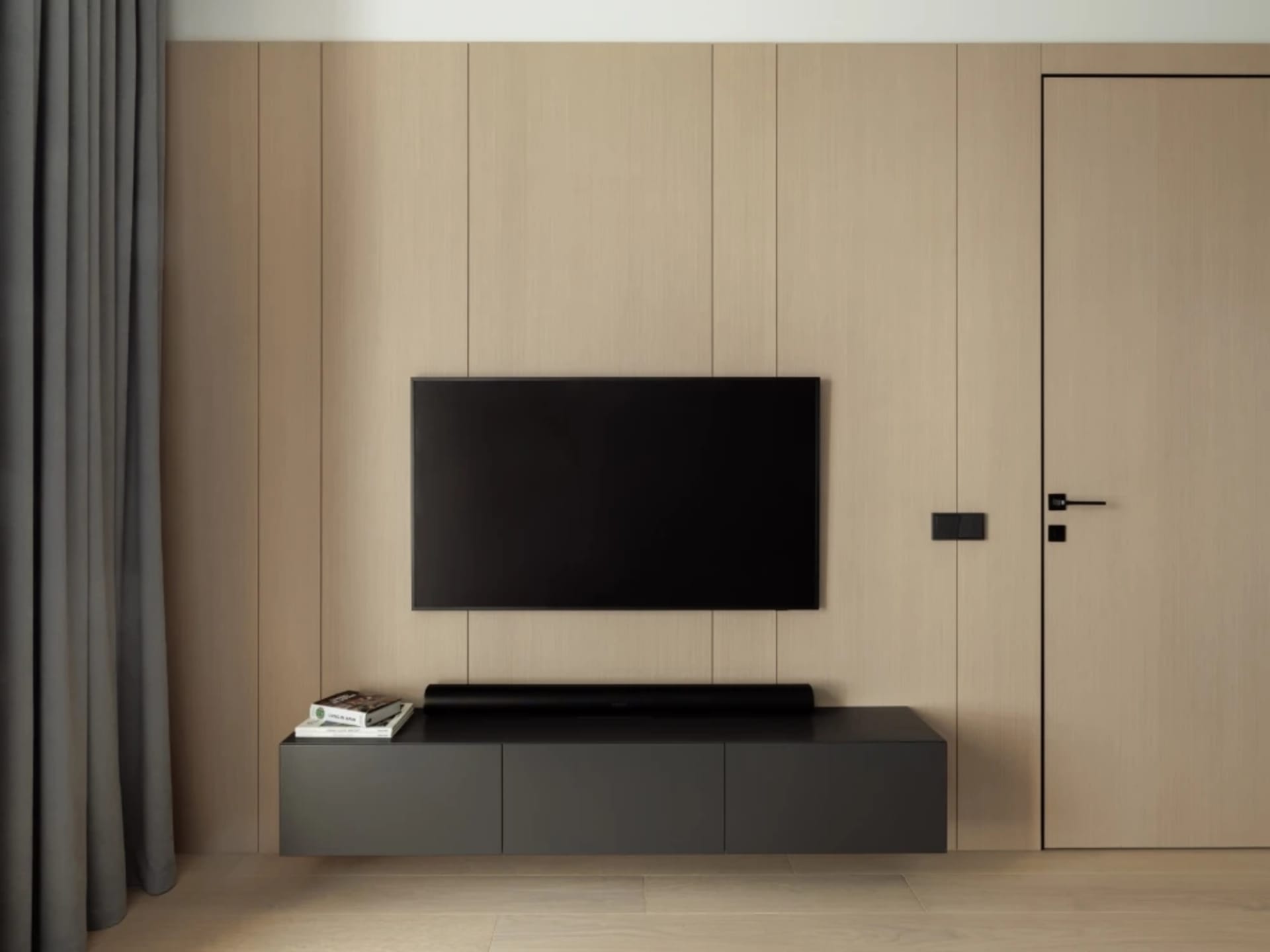 A modern living room with a wooden wall, a flat-screen TV mounted above a floating black console, and a black curtain on the