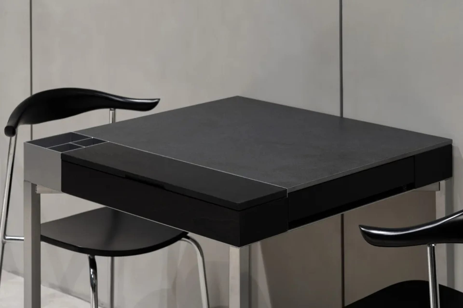 A sleek, modern metal desk in black.