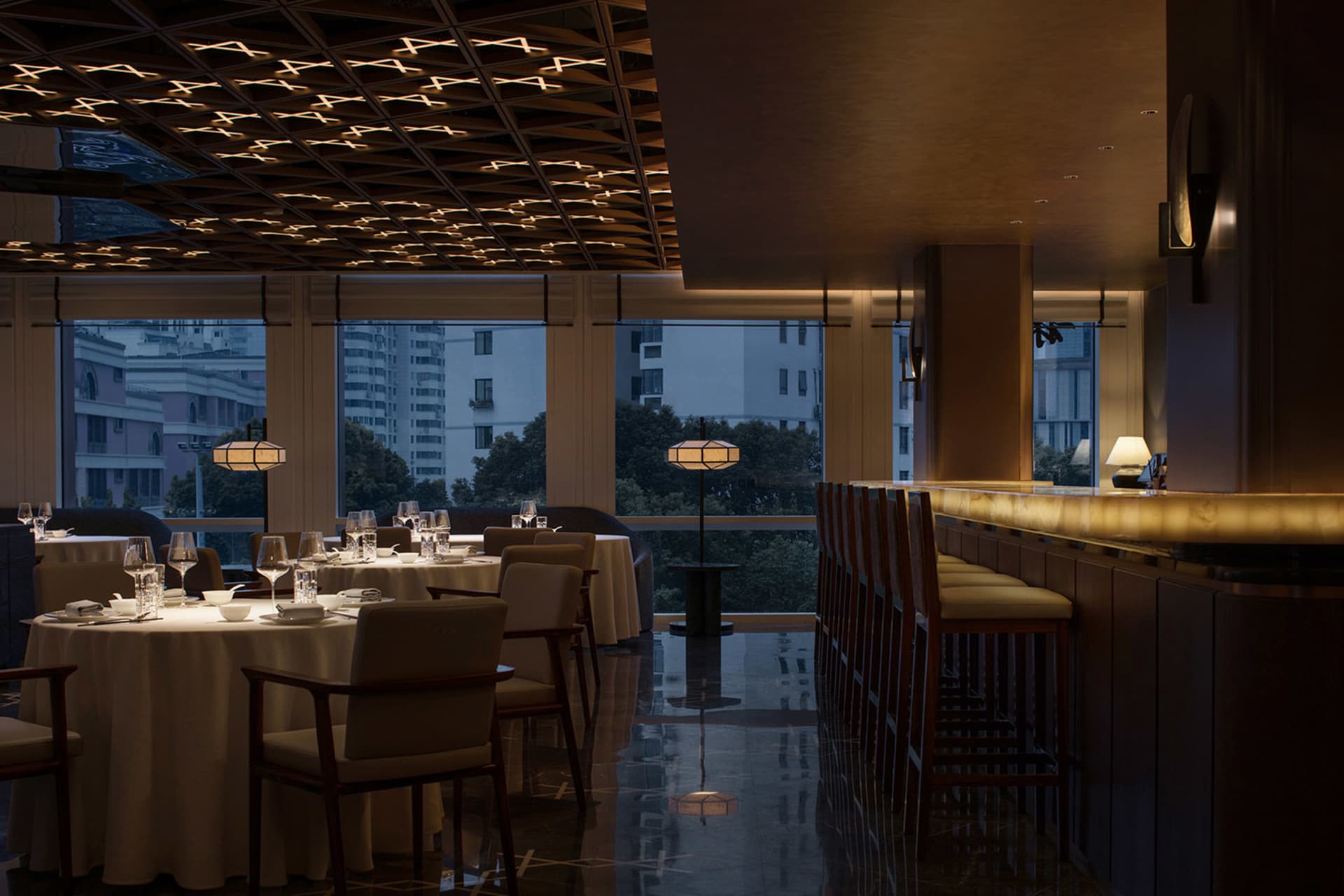 Modern interior design of a restaurant bar with marble and wood finishes.