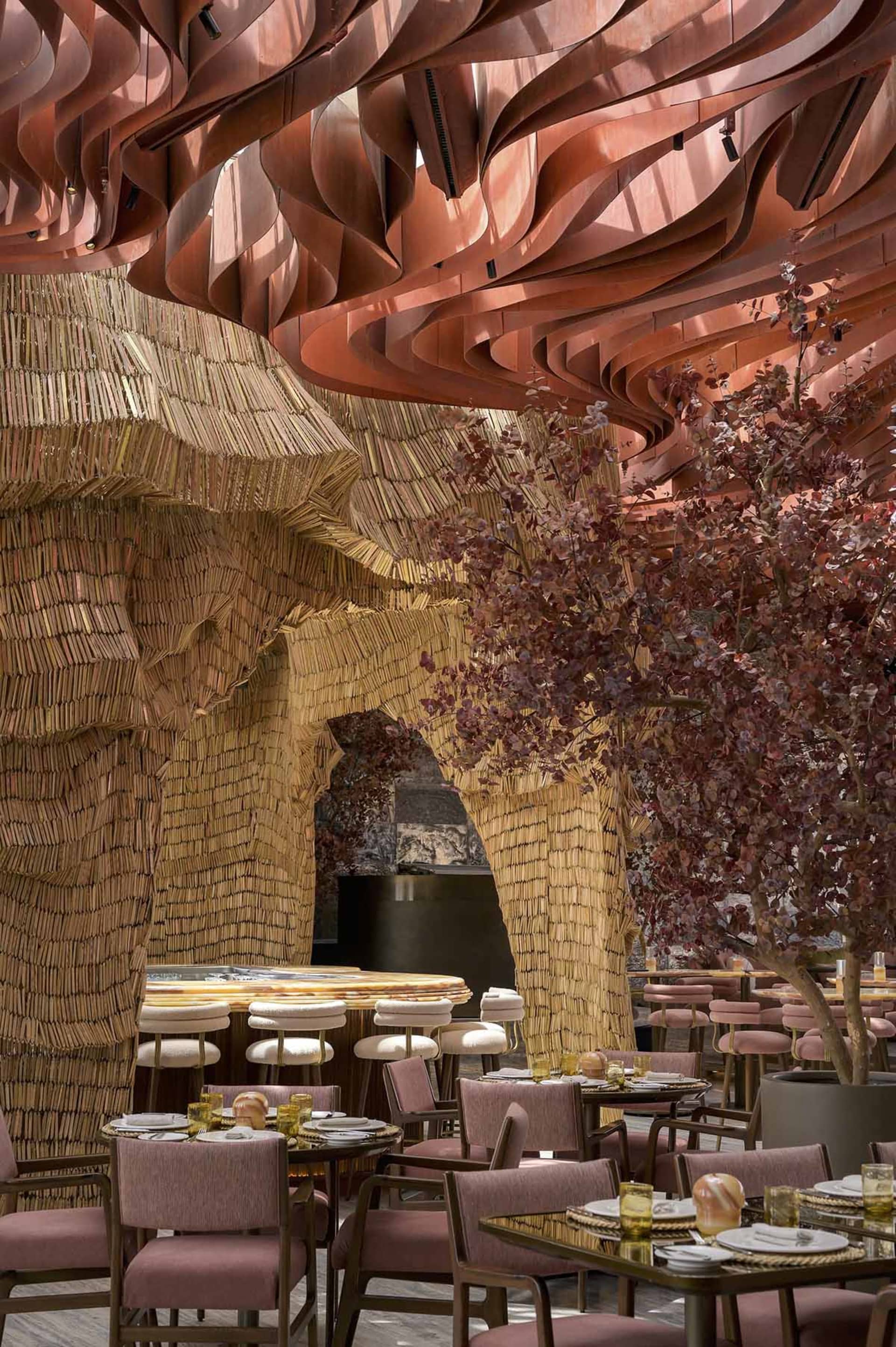Interior design of a restaurant featuring industrial elements and metallic waves