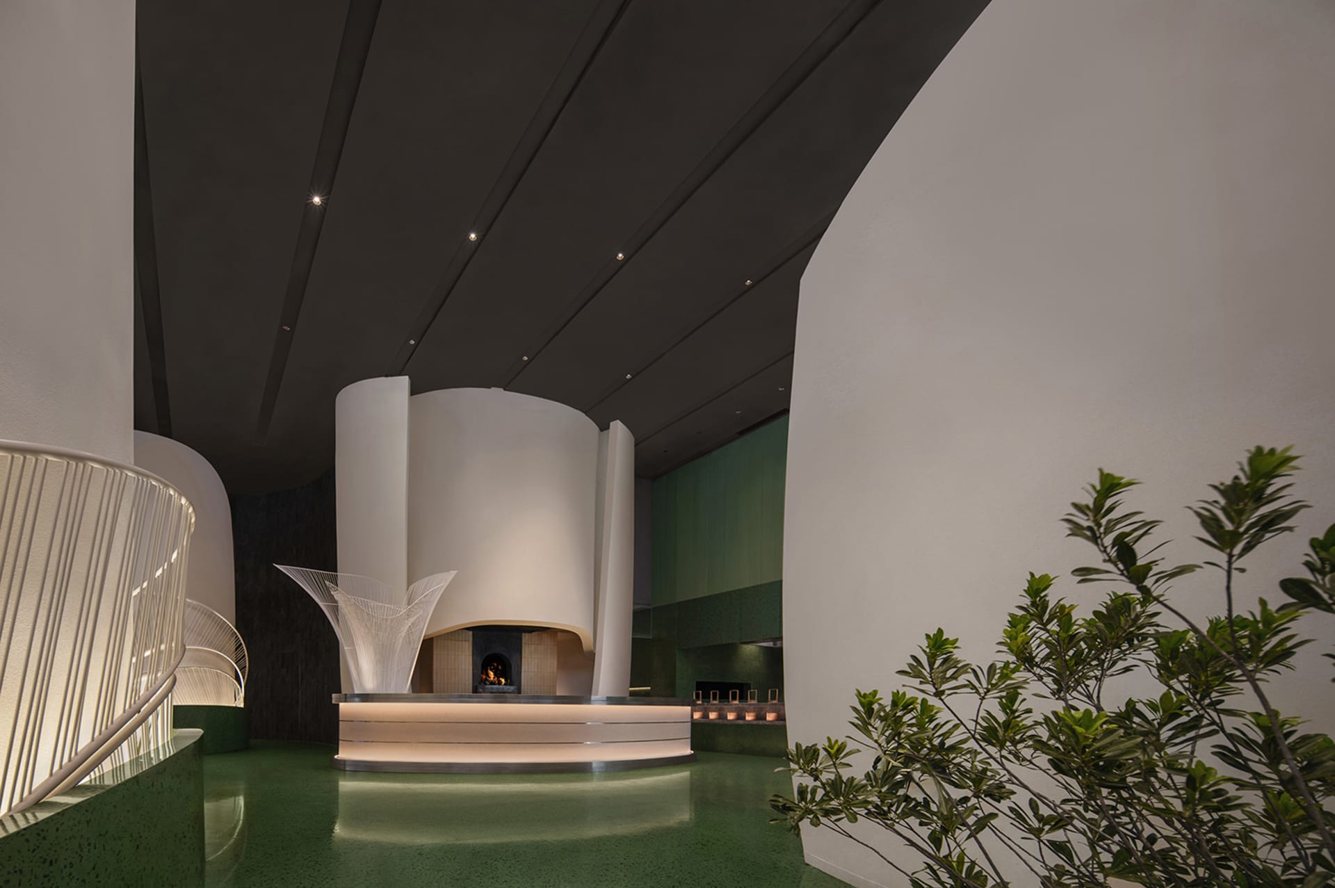 A modern hotel reception area with sleek, industrial-inspired design elements.