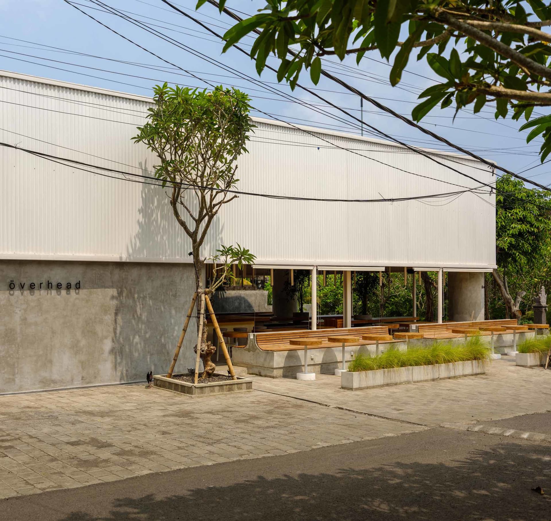 Modern industrial building exterior with concrete walls and minimalist design.