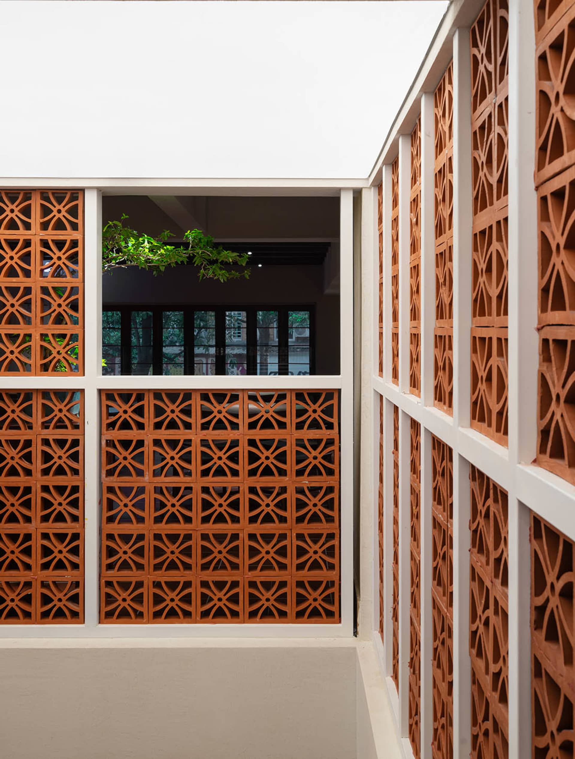 A modern interior design featuring brick walls with intricate patterns.