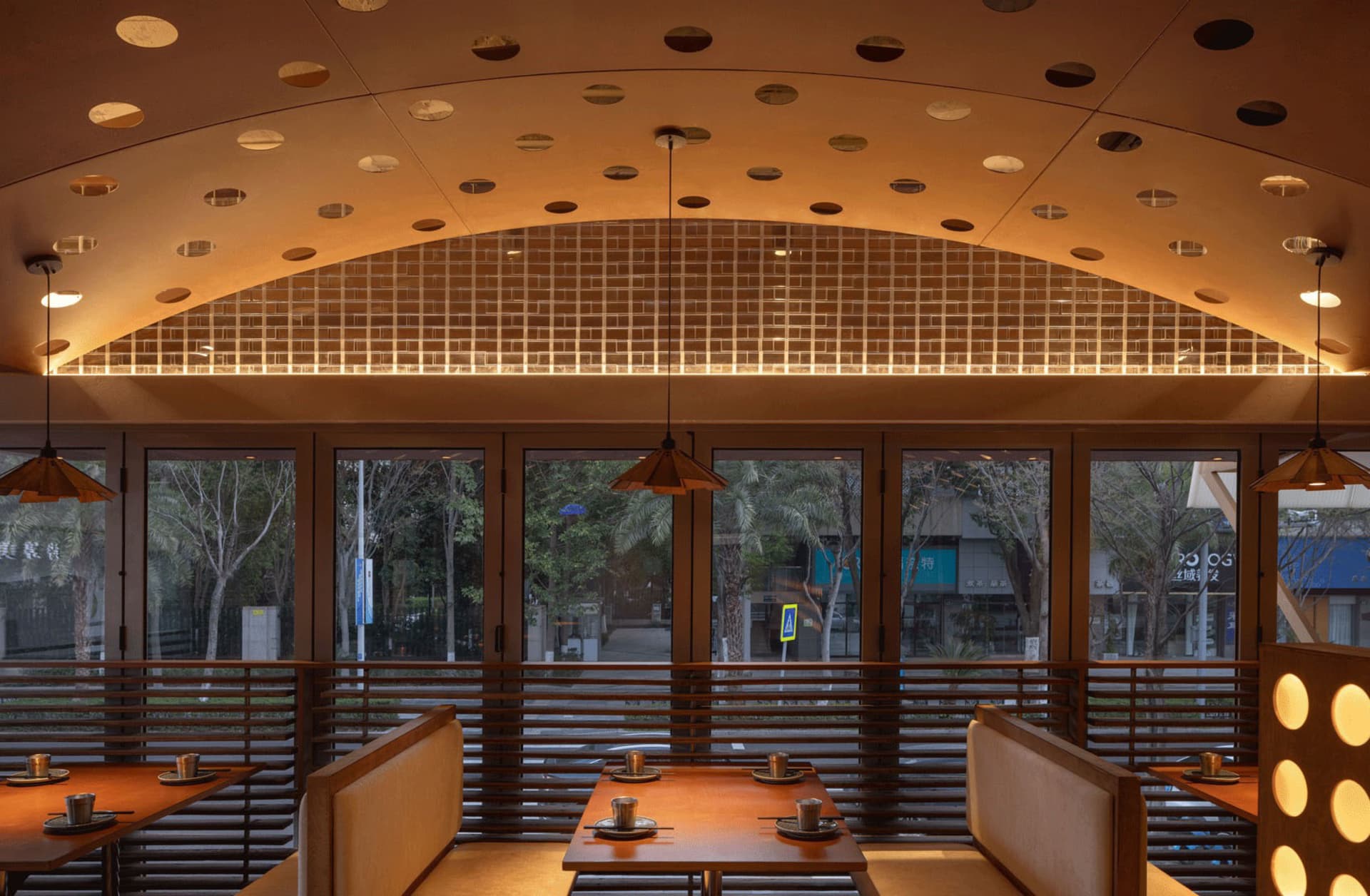 A modern restaurant interior featuring wooden materials.