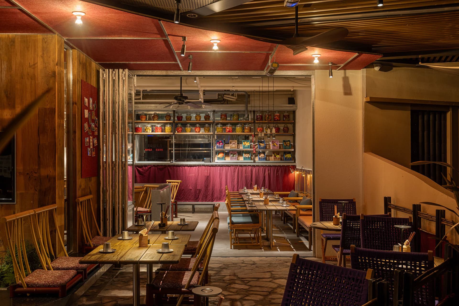 Modern industrial-style cafe bar with wooden furniture and concrete floor