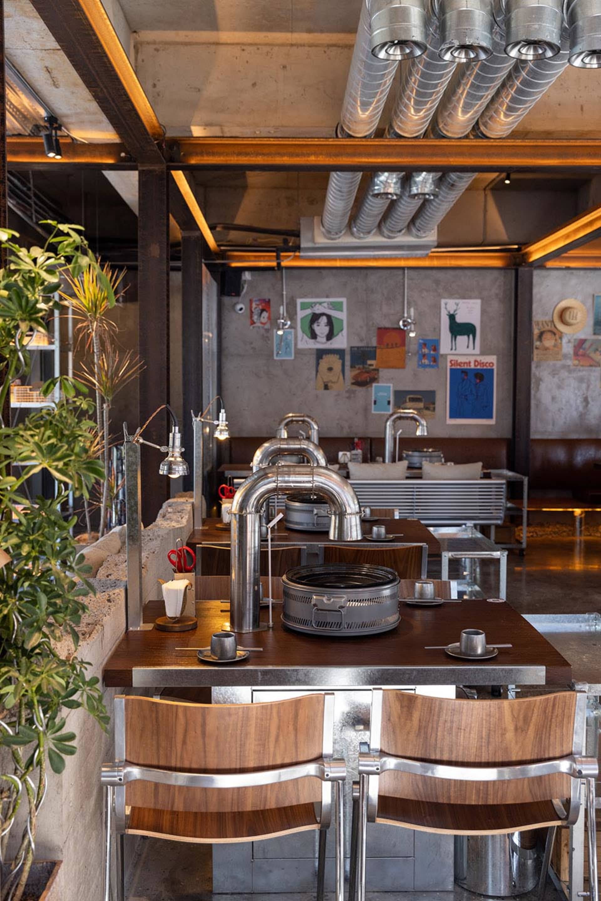 Industrial-style restaurant interior featuring metal and wooden elements