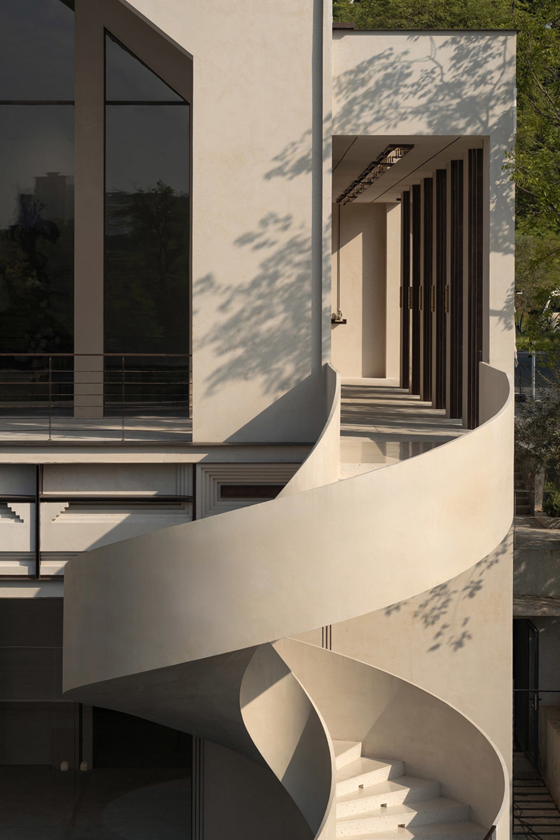 Concrete staircase leading to a modern architectural design.