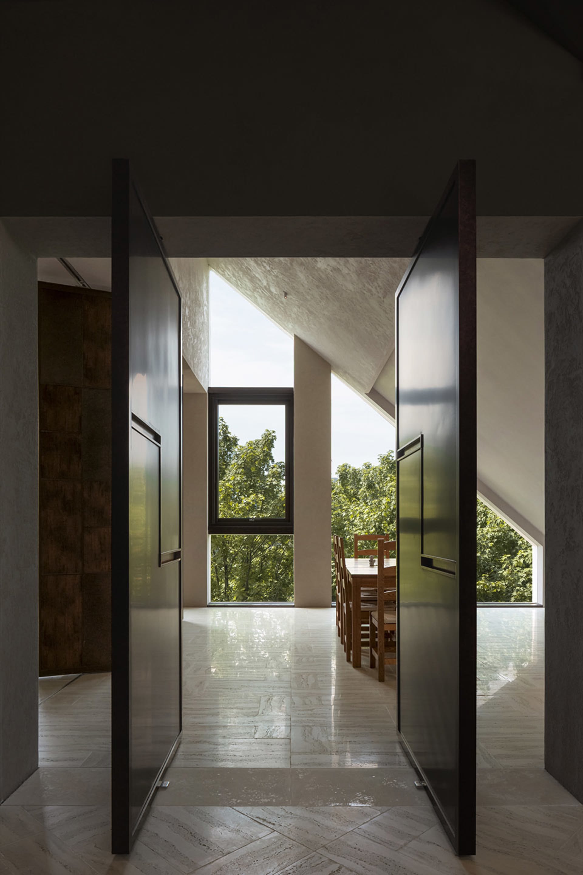 Modern living space featuring stone flooring without masonry features.