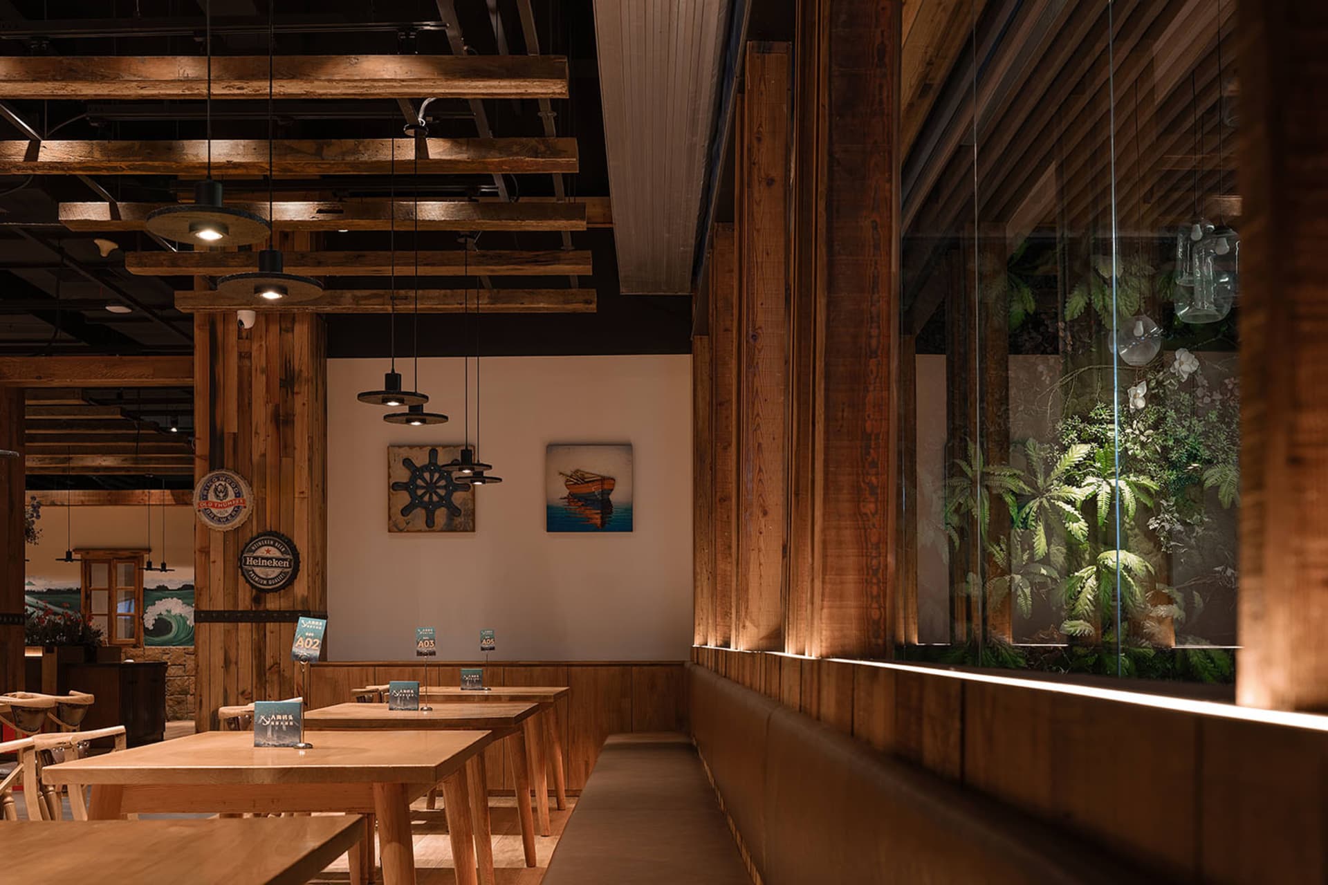 Modern industrial restaurant interior with wooden furniture and exposed wooden beams.