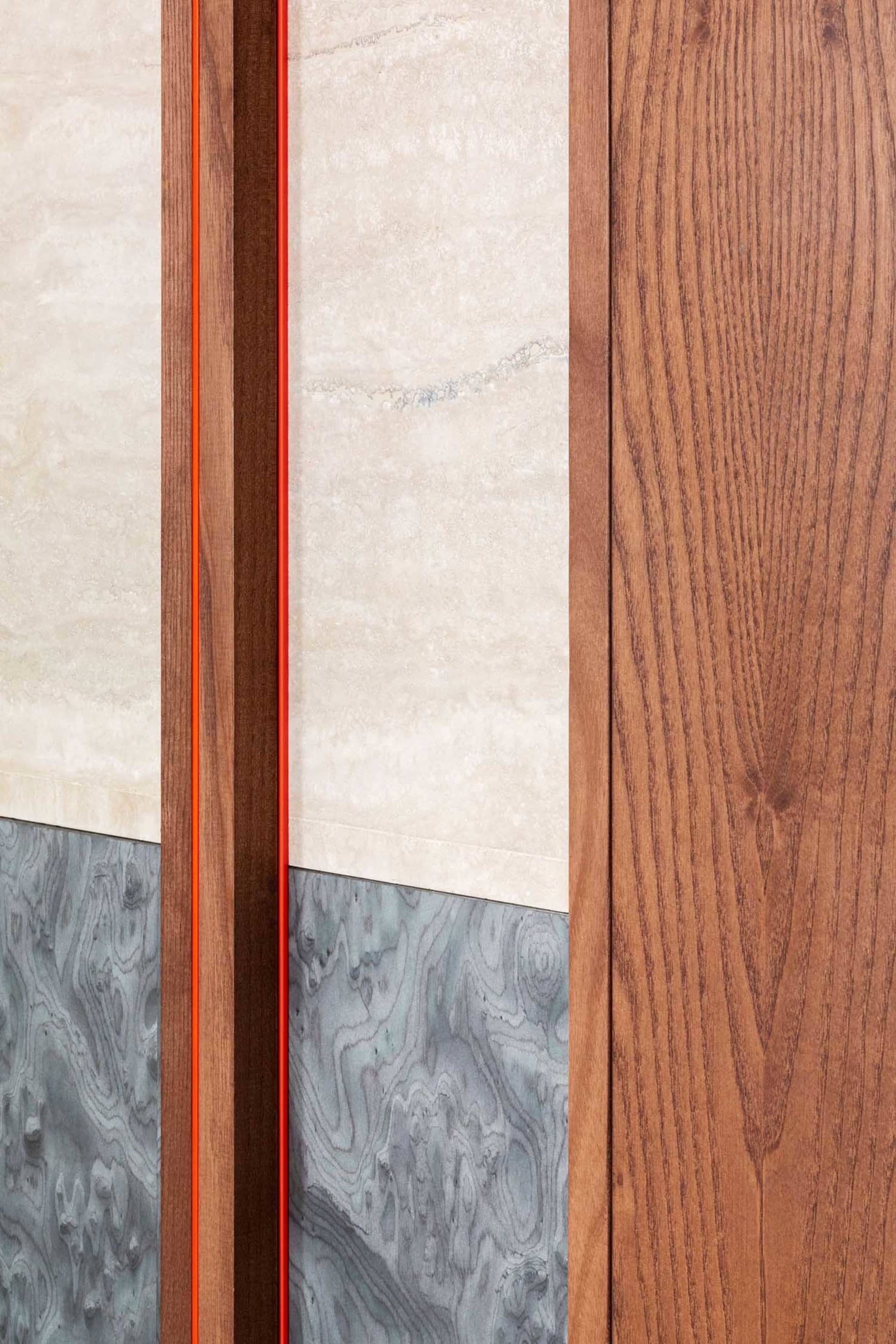A modern interior design featuring wood, marble, and concrete materials