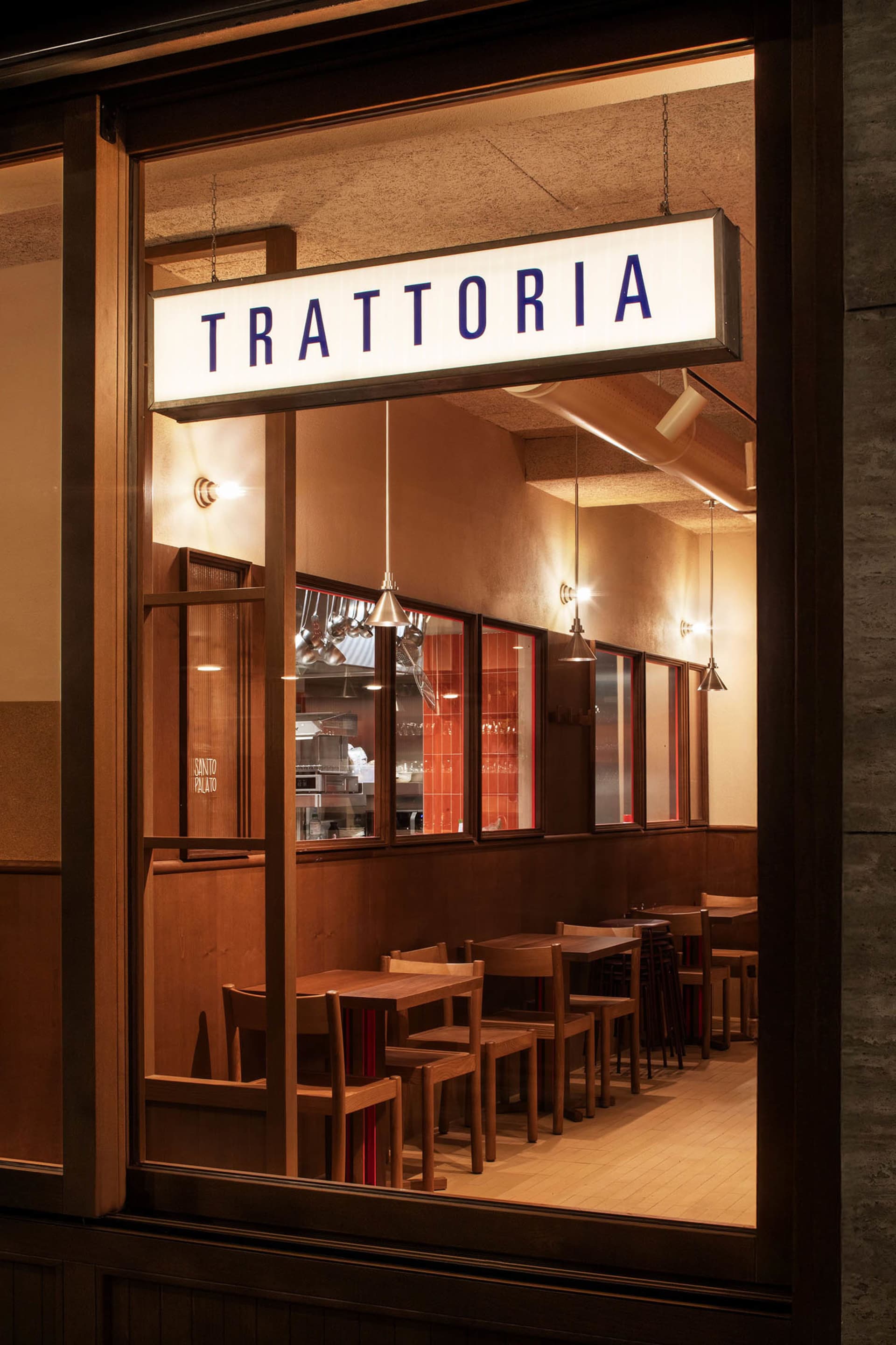 Restaurant interior with wooden furniture and warm lighting