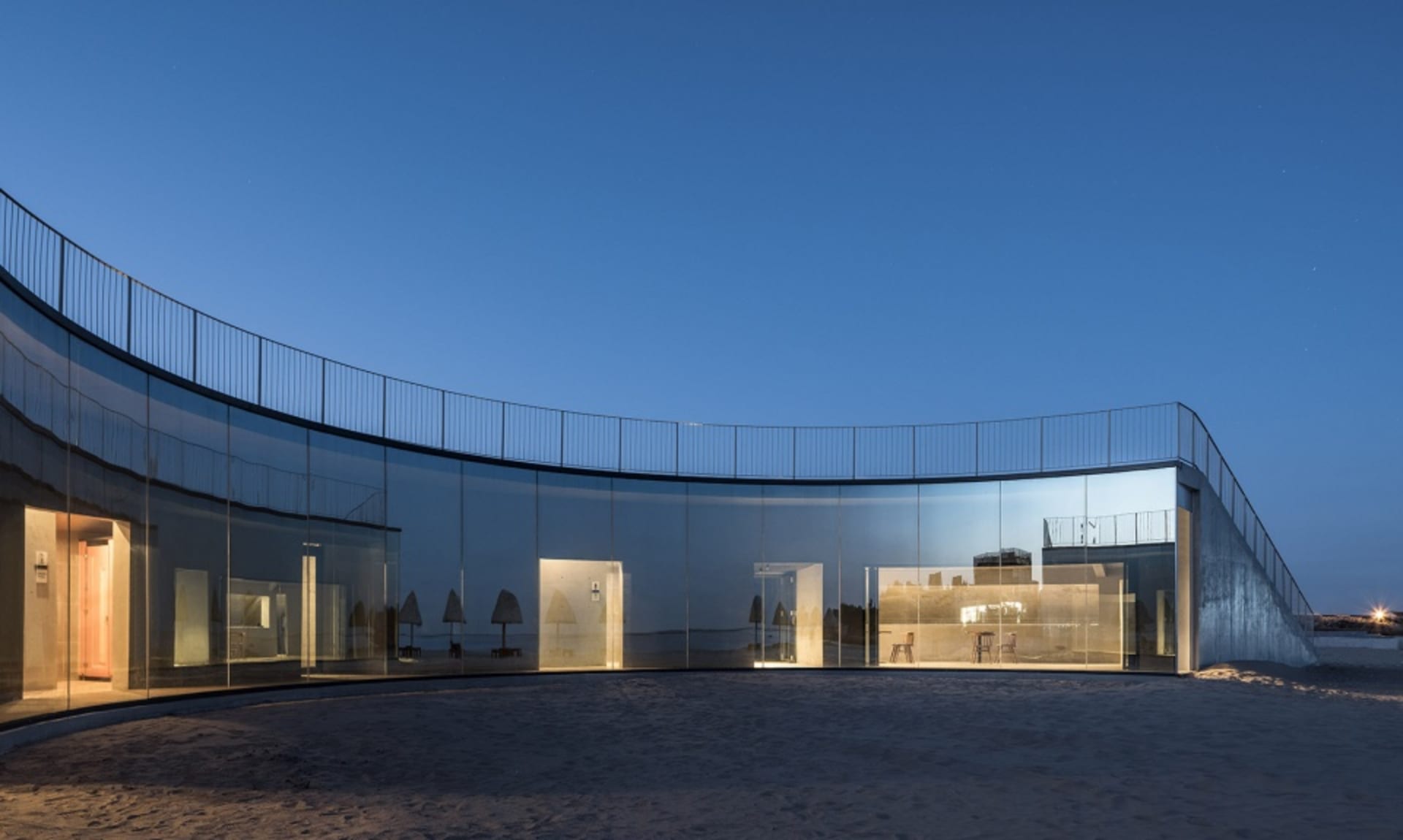 Modern building with all-glass facade at night