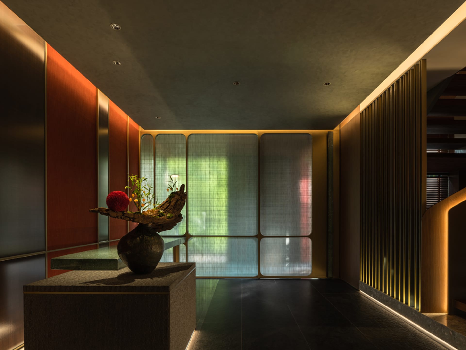 Modern interior design featuring a corridor with metal-clad walls and a potted plant on a dark bench.