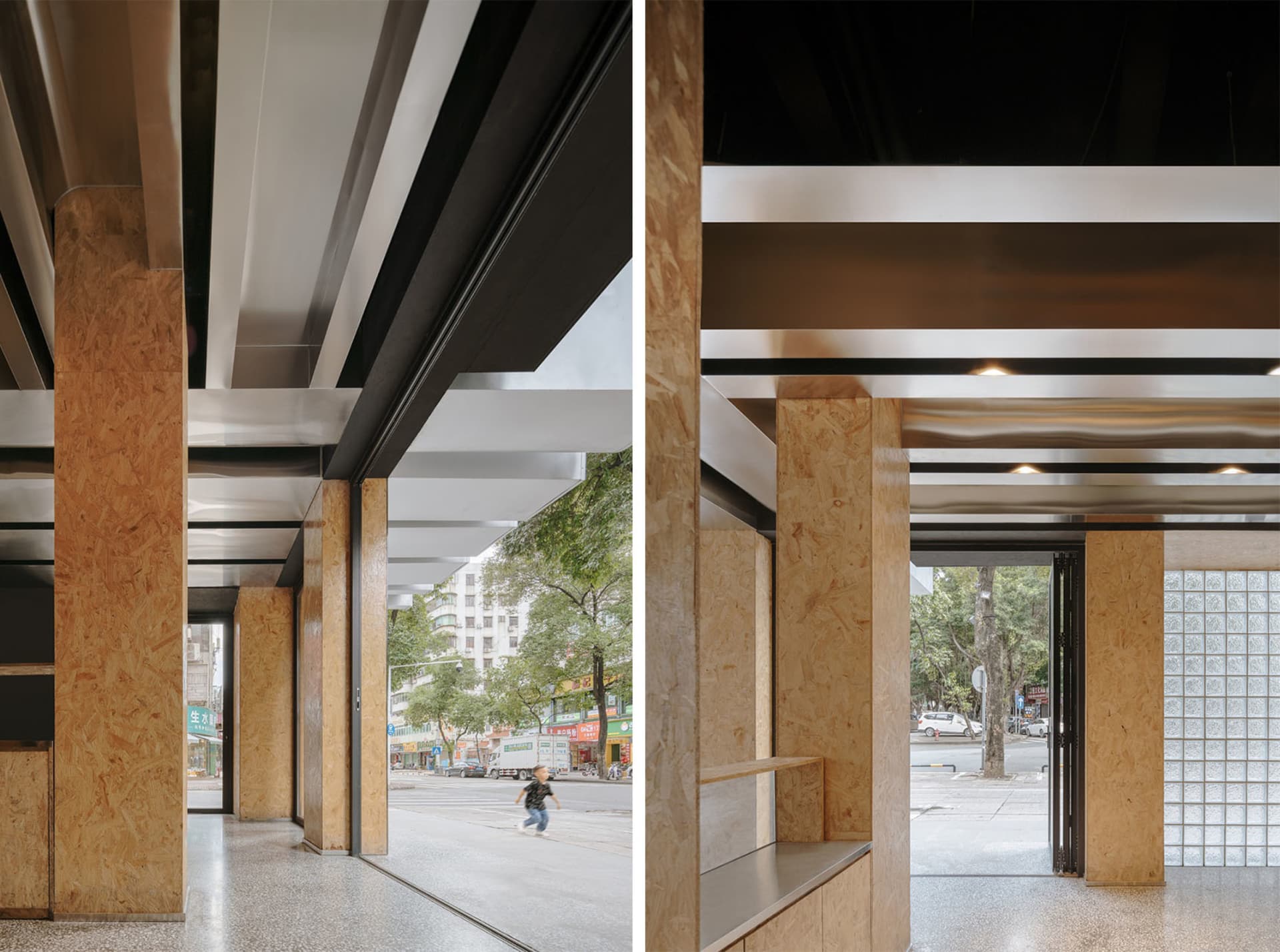 Modern exhibition space with wooden, concrete, and black metal architectural elements.