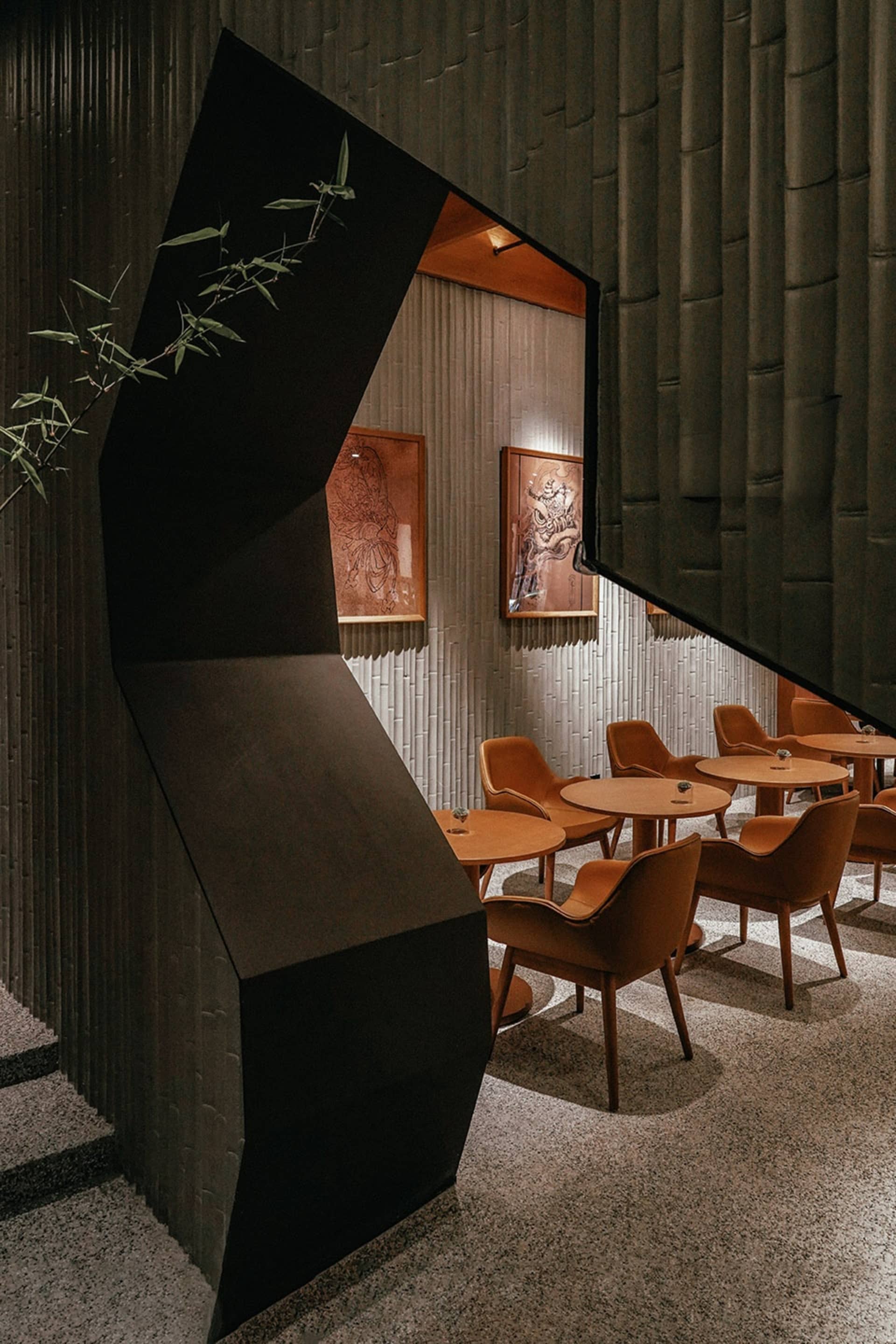 A sleek, modern restaurant interior featuring wood shingles