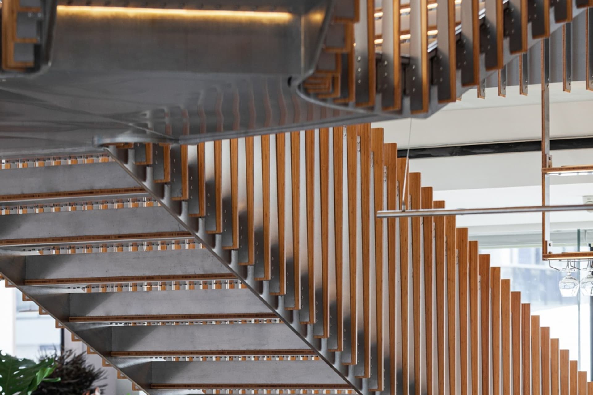 Modern staircase featuring steel and wooden elements