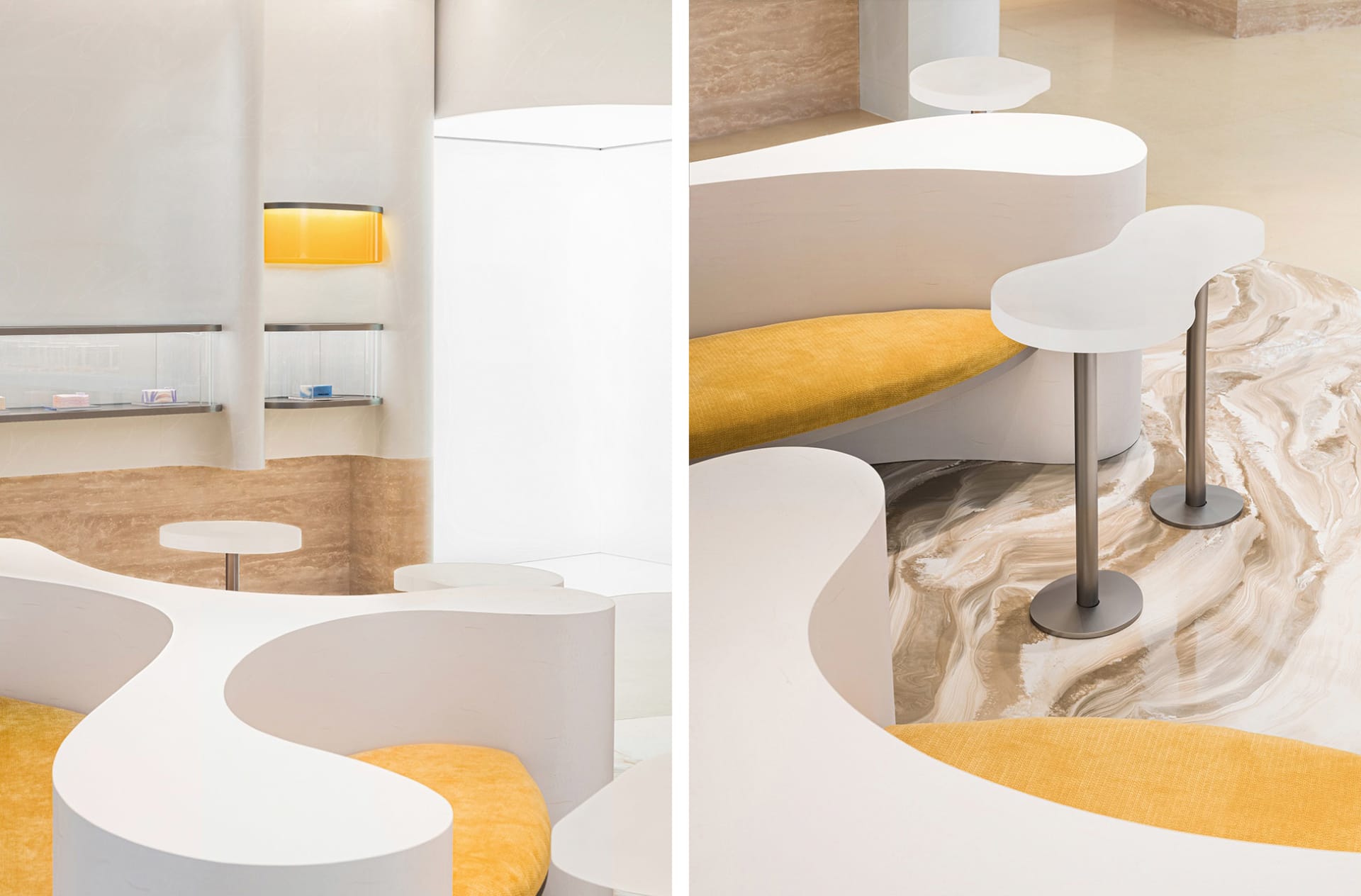 The image showcases a modern restaurant interior with a marble countertop and seating area.