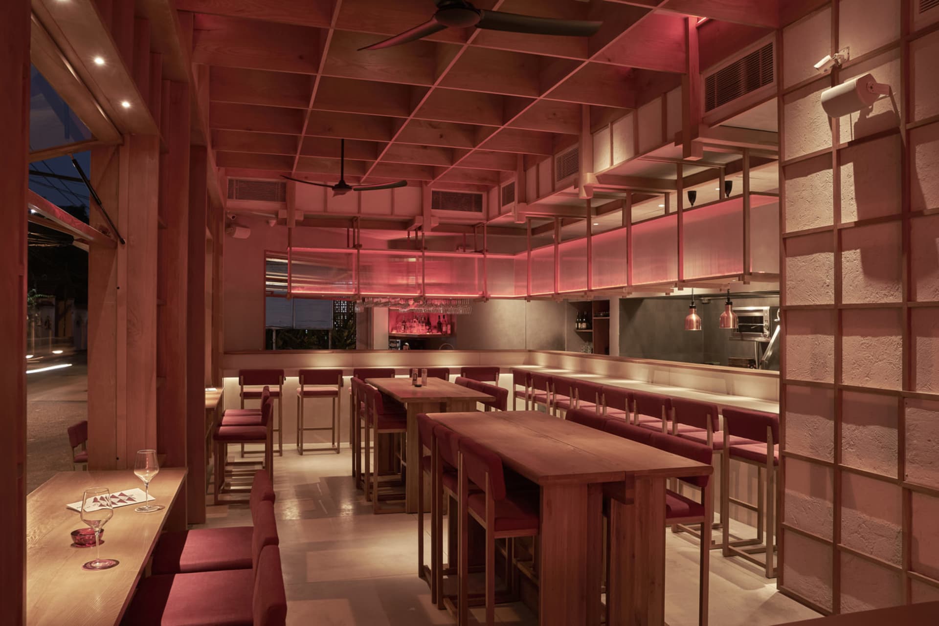 Interior of a modern restaurant with wooden furniture and decor.