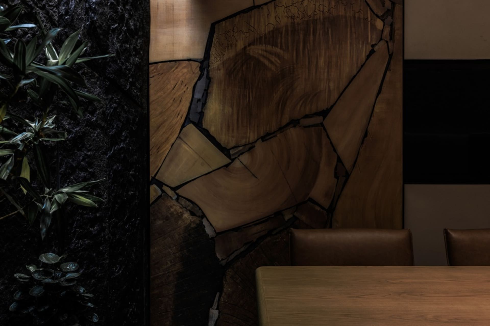 Modern restaurant interior with a focus on wooden decor elements.