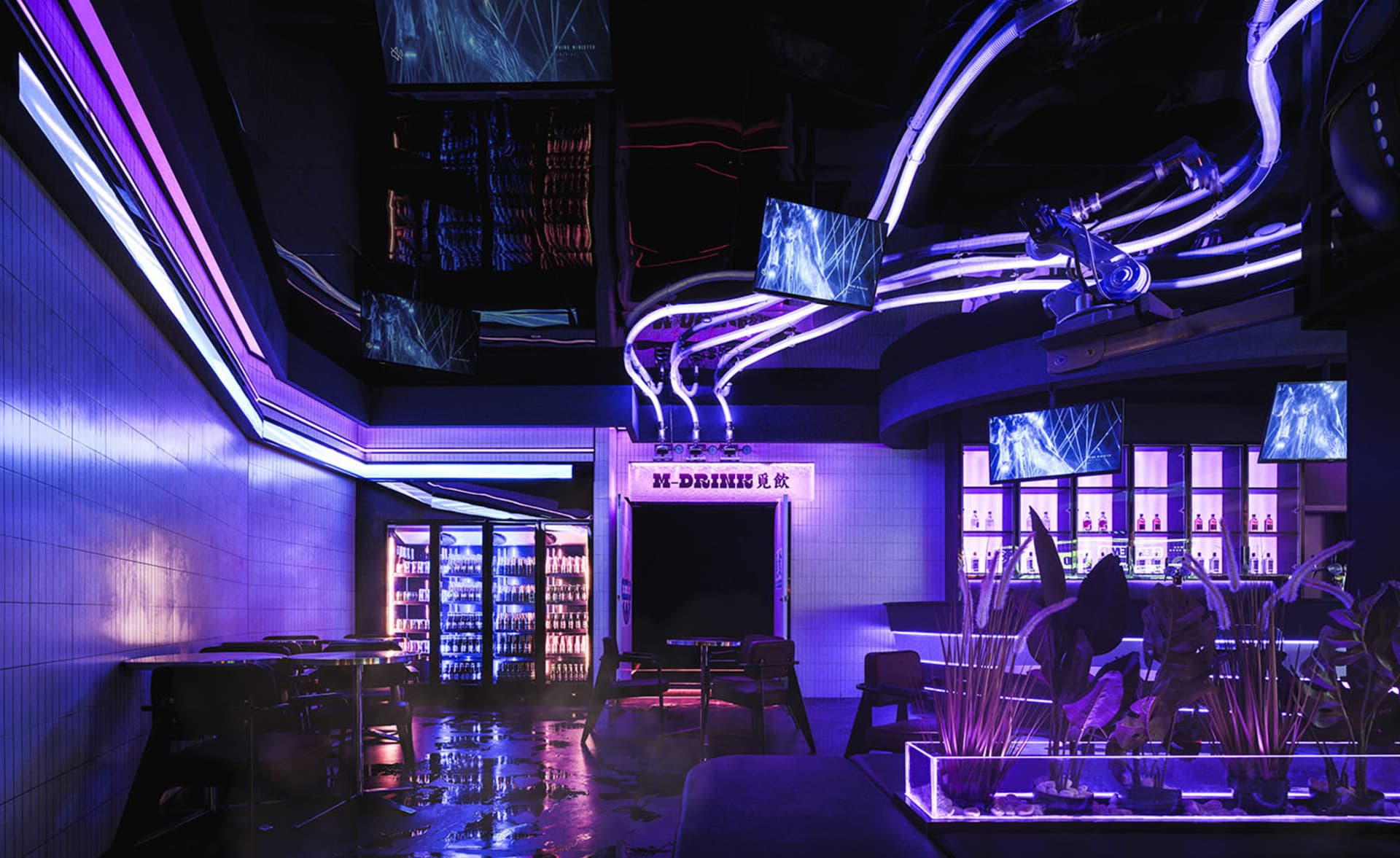 An industrial-style bar interior with neon lighting, concrete walls, and a warm, welcoming atmosphere.