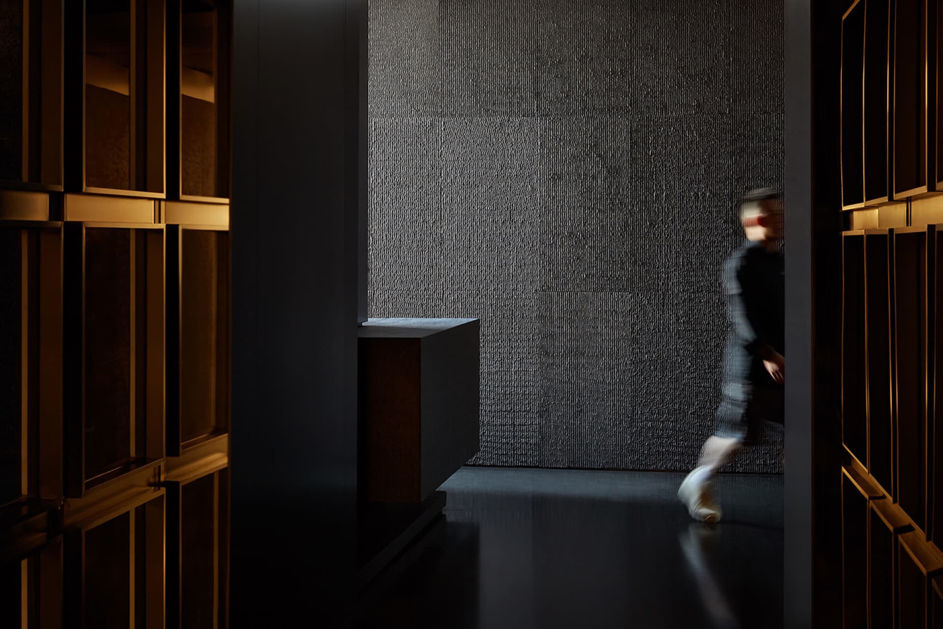 Modern interior design featuring a textured wall panel.