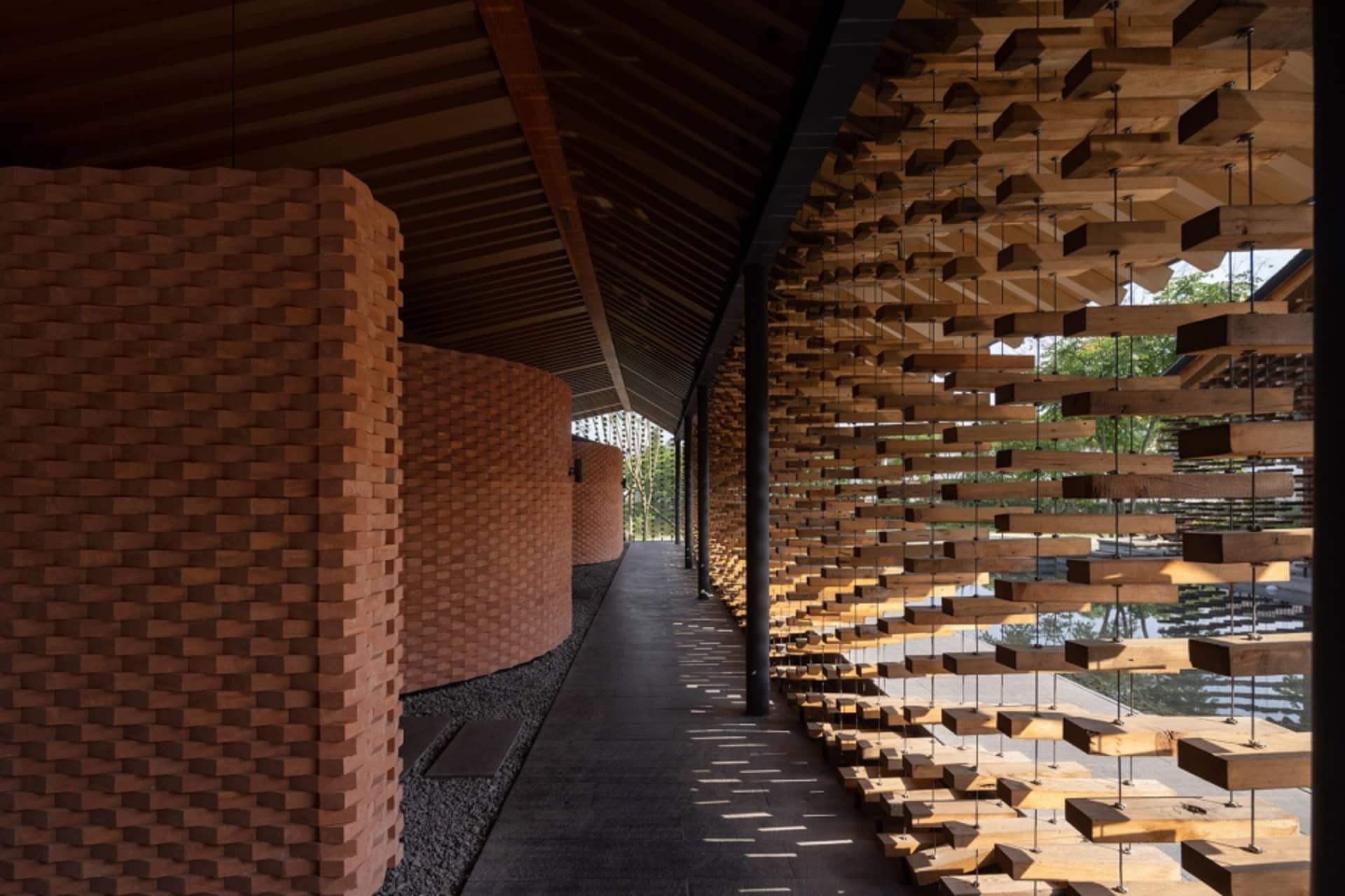 Modern corridor with wood slats and brick walls