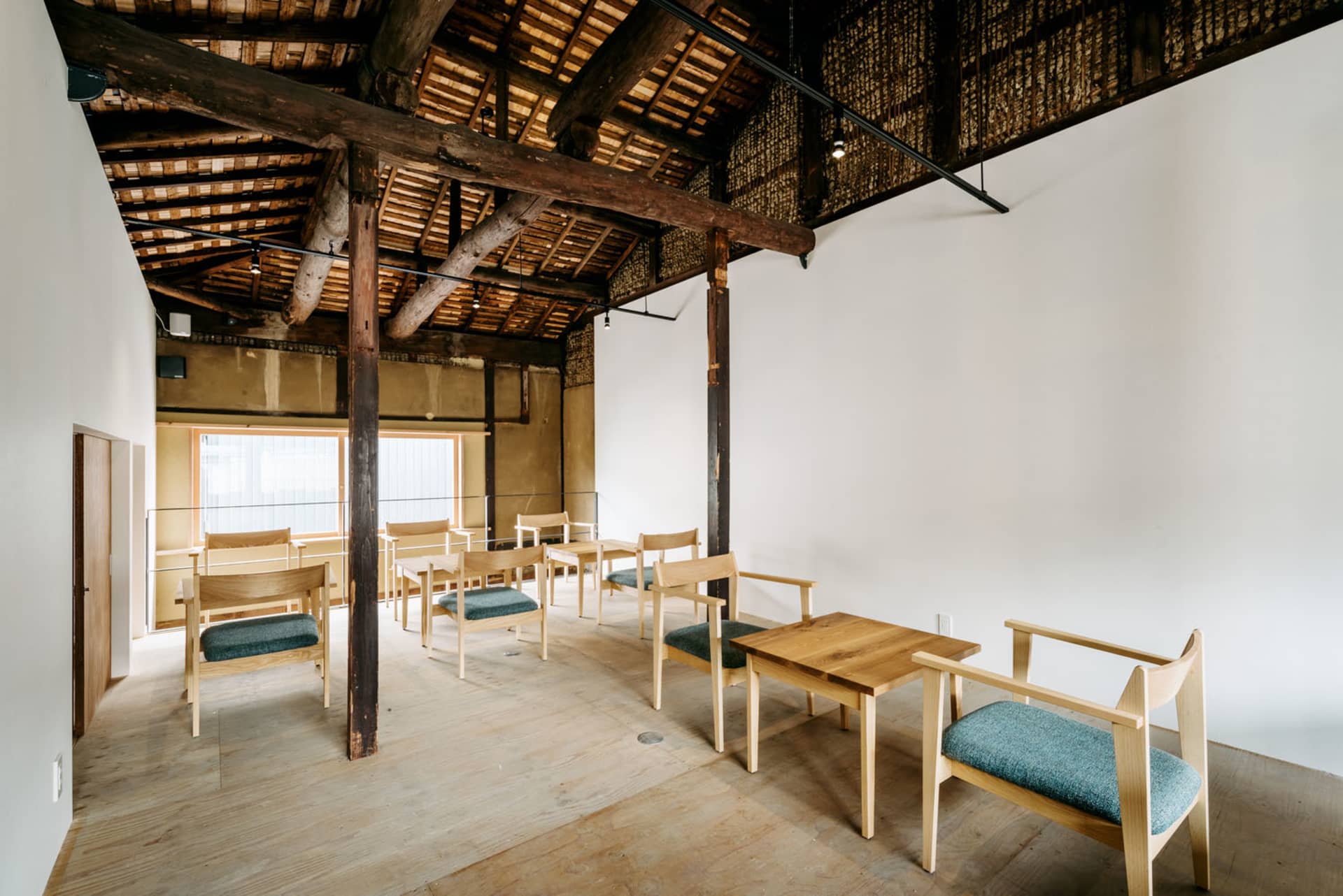 A modern cafeteria with wooden furniture, featuring minimalist design elements and natural lighting.