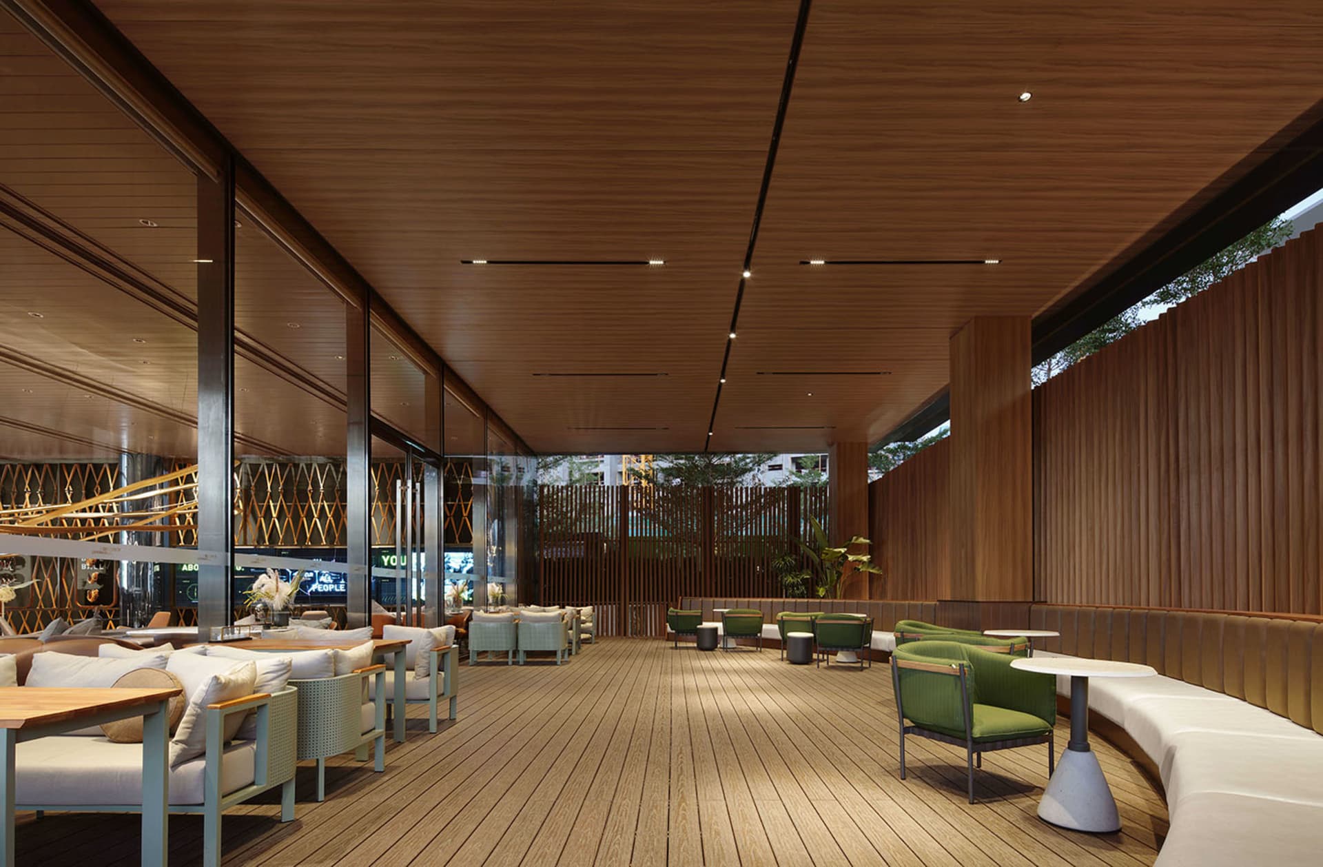 Modern restaurant interior with wooden accents, fabric seating, and mixed materials