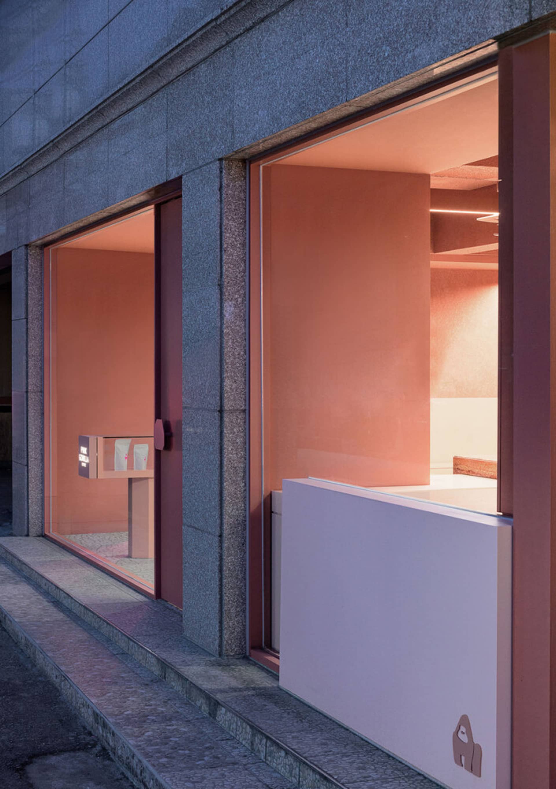 Modern retail stall with glass storefront.
