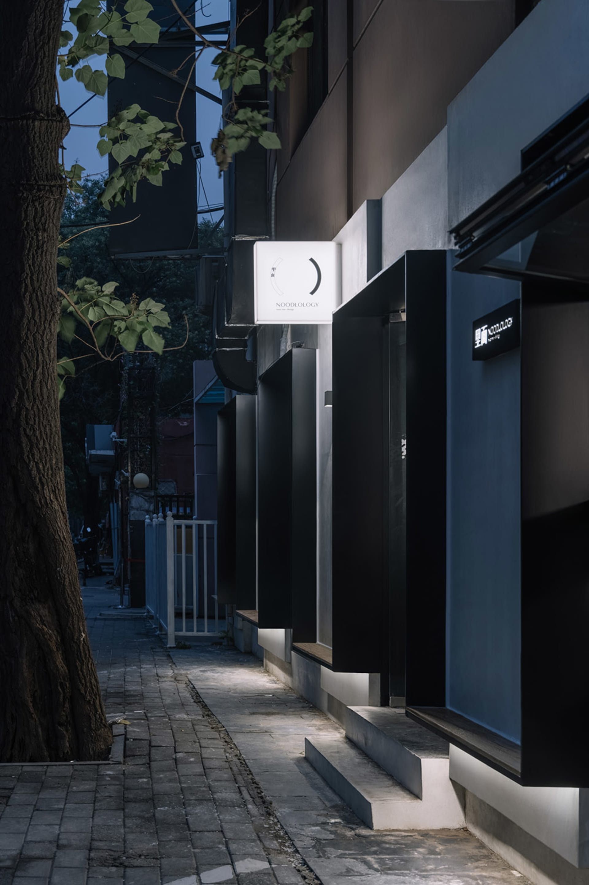 A modern storefront with a concrete exterior.
