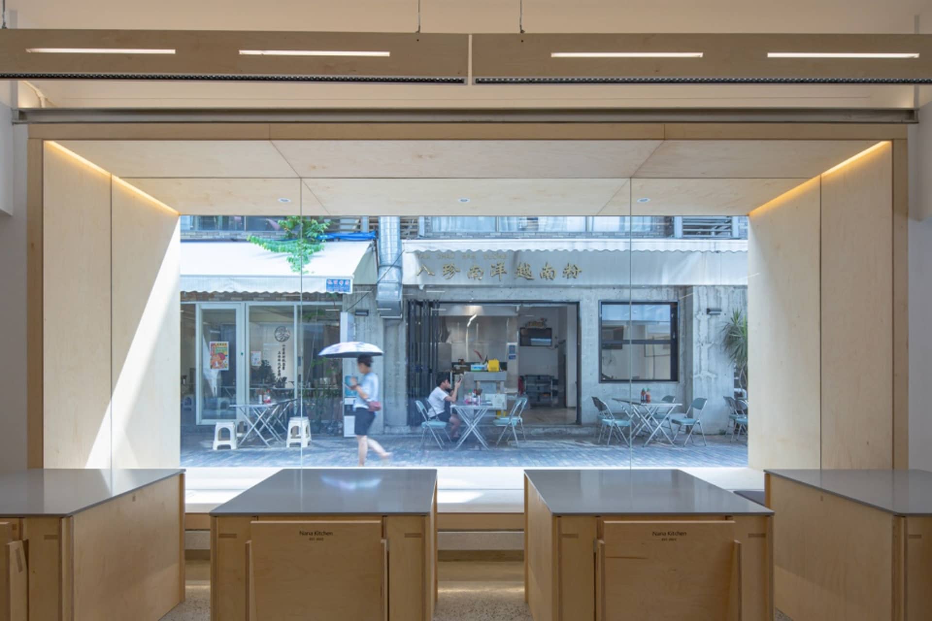 Modern cafe interior with wood, glass, and concrete elements