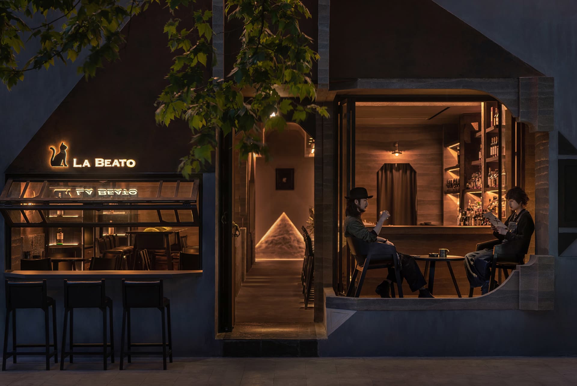 A cozy, modern restaurant bar with wooden finishes and a warm, inviting atmosphere.