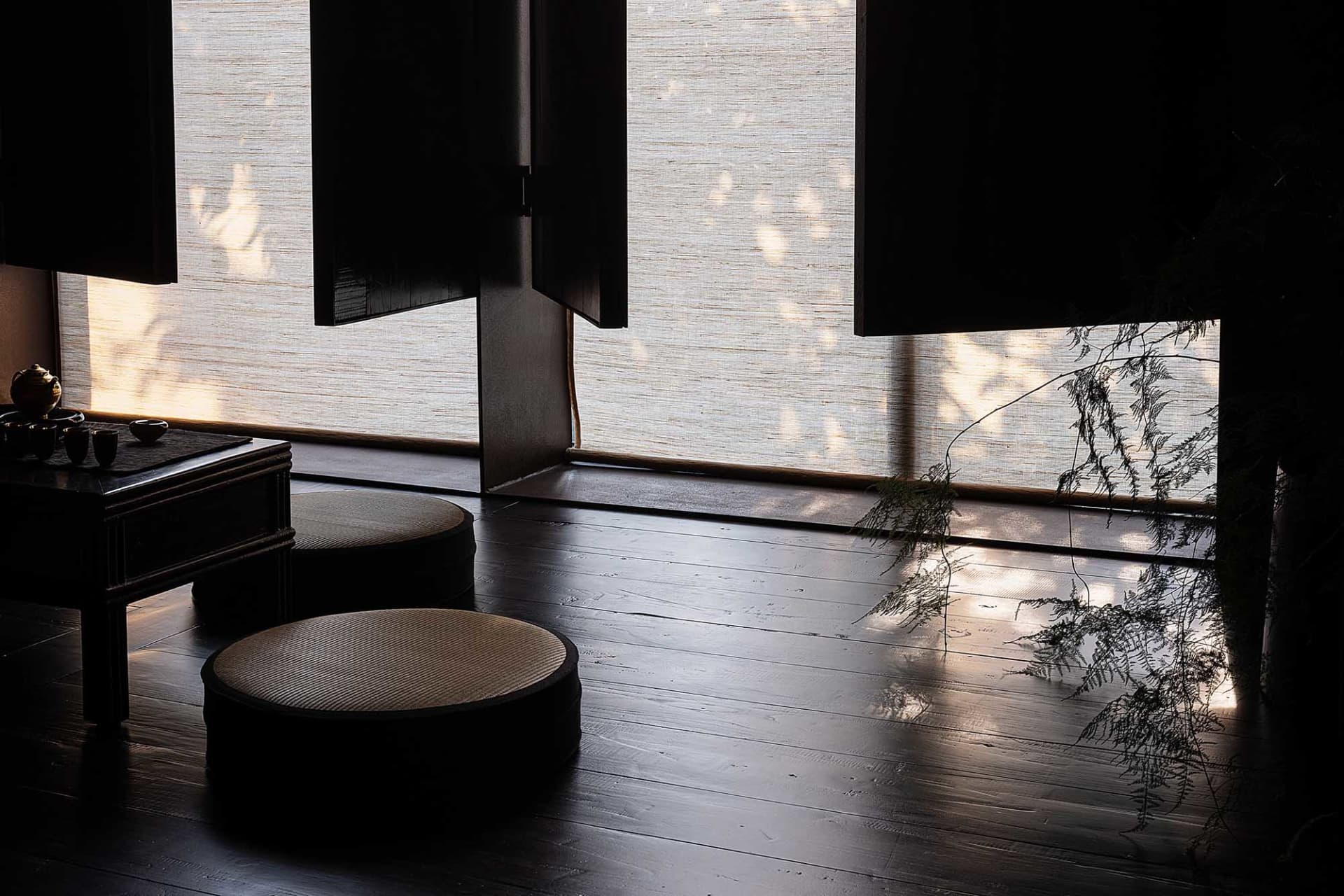 A serene bamboo-blinds-living-room with natural lighting and minimalist interior design.