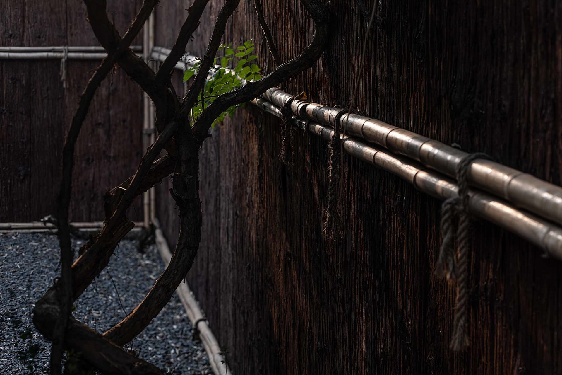 Minimalist wooden barrier with metal pipes attached