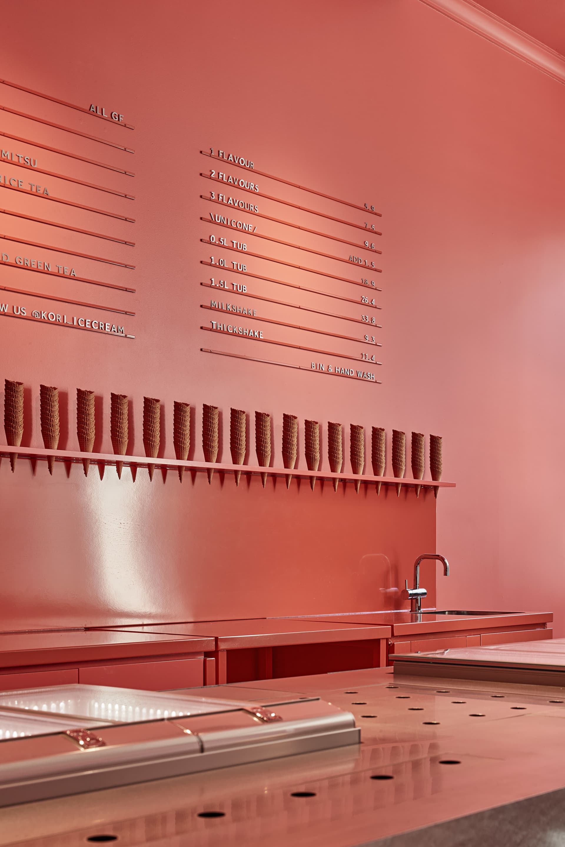 Coral pink-colored retail space with ice cream cones on display
