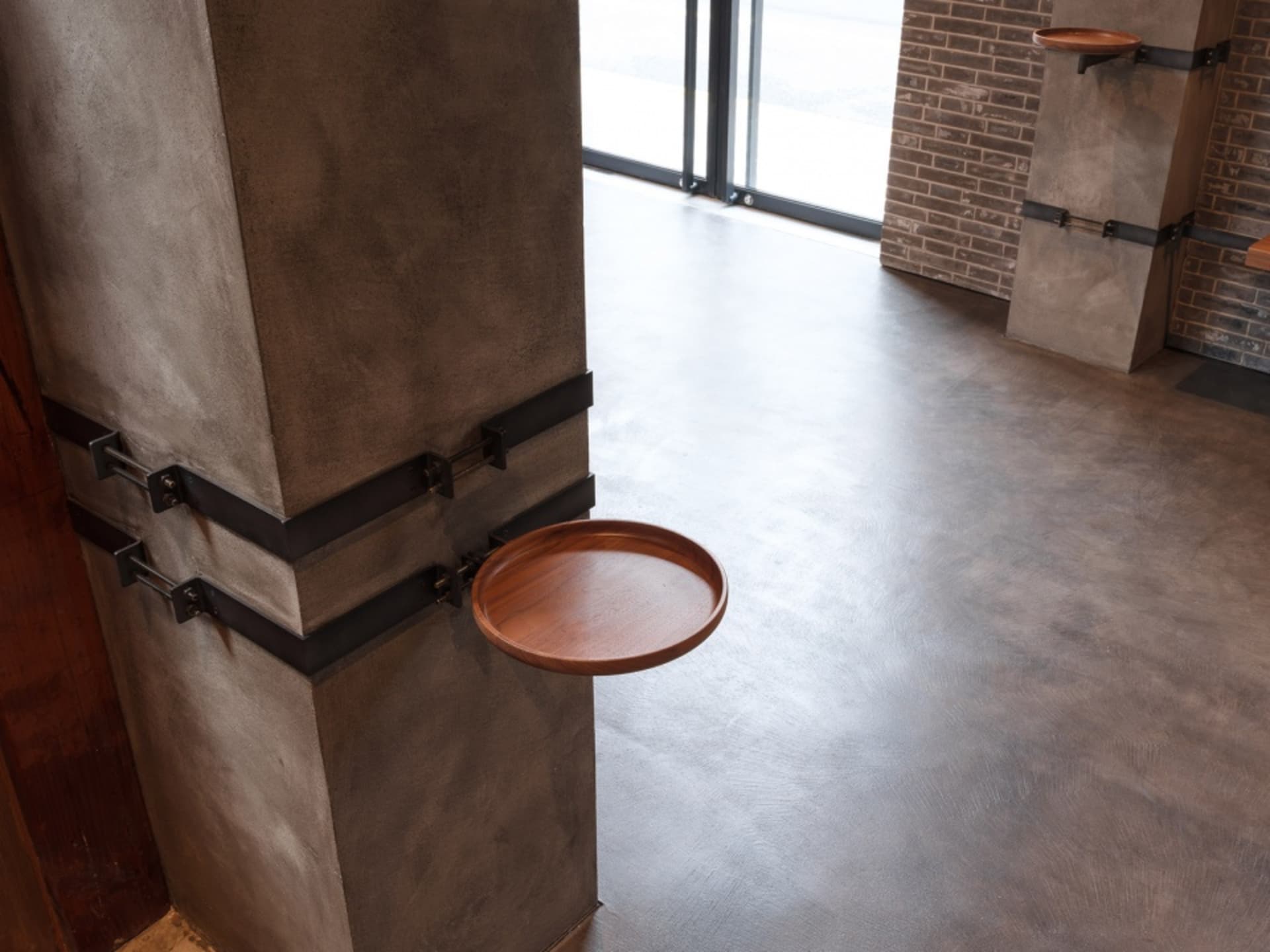 A sleek, modern industrial kitchen counter top made of wood and concrete