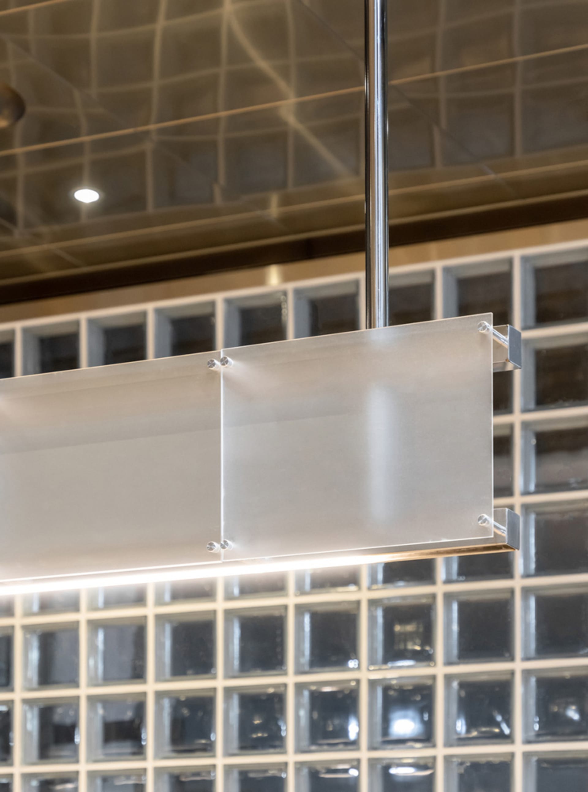 A modern interior design featuring glass walls.