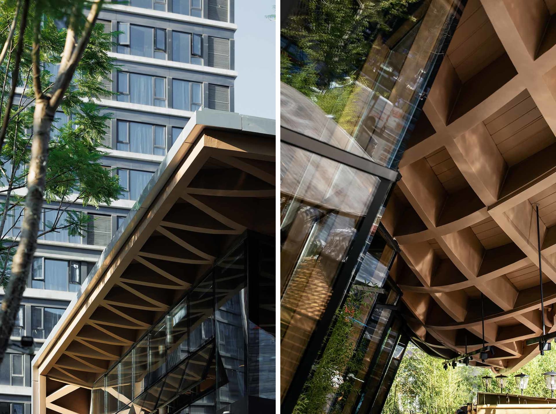 Modern building with a wooden exterior featuring geometric design elements and glass panels.