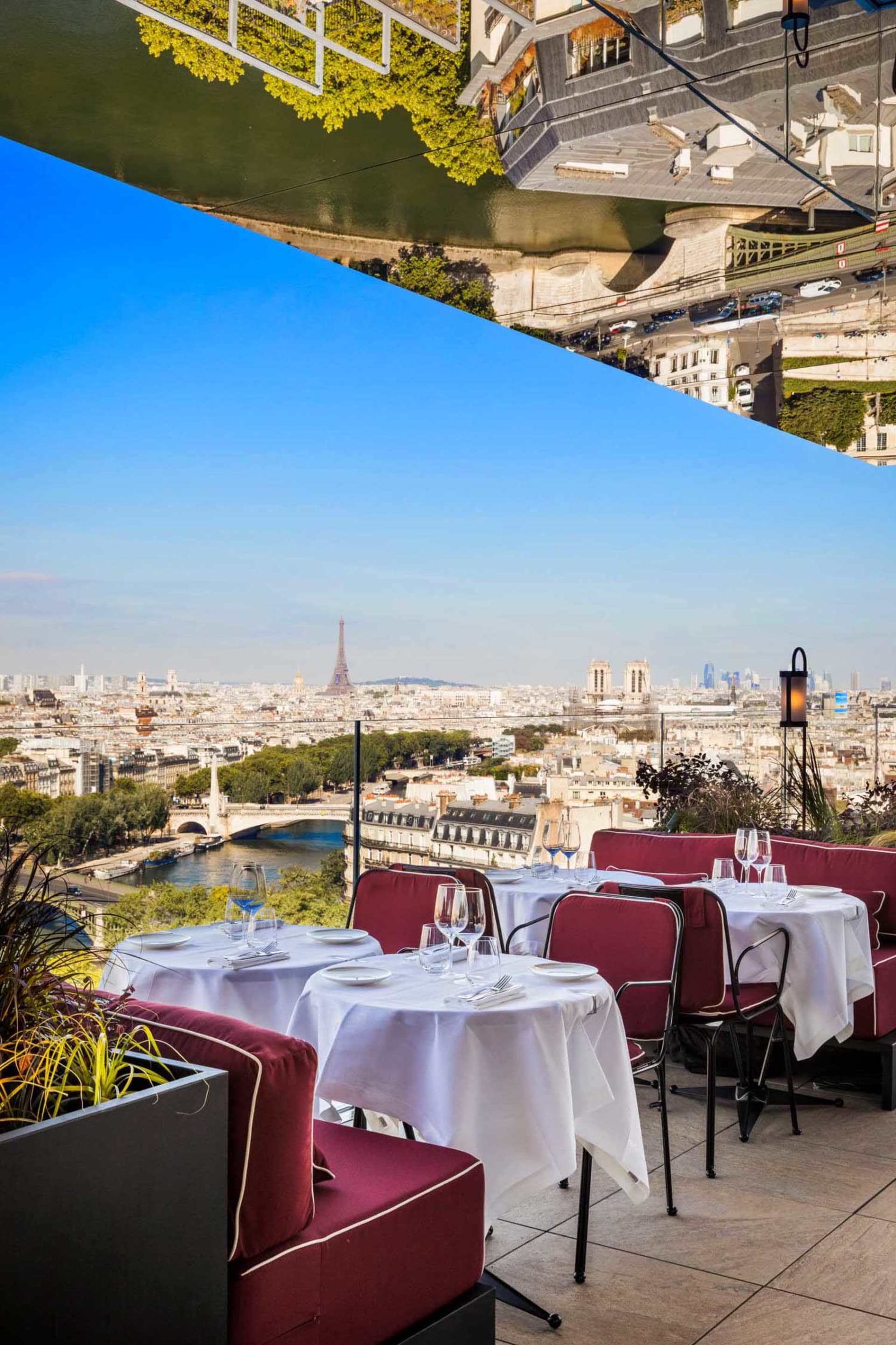 Restaurant setting with modern furniture overlooking cityscape