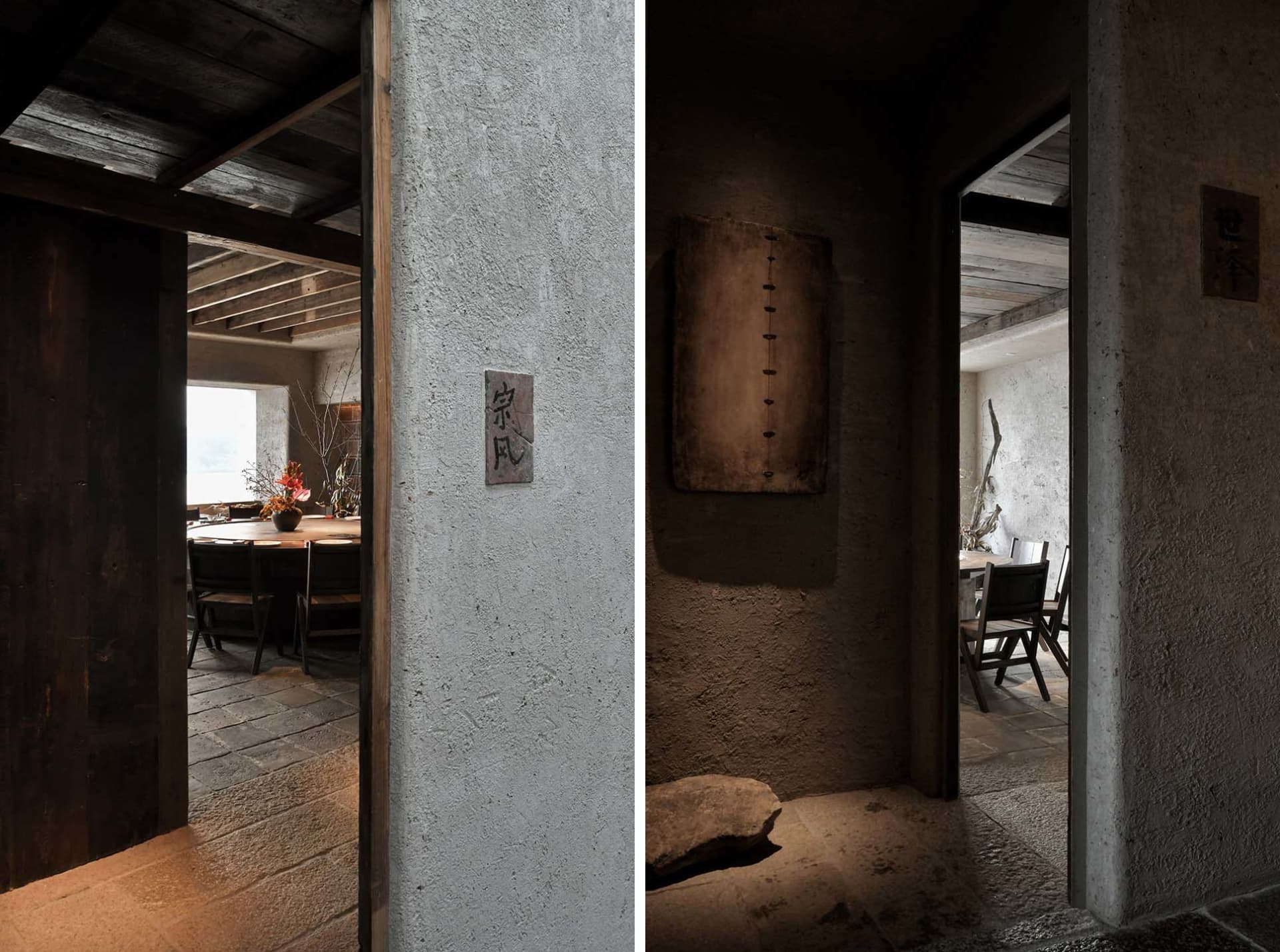 A modern restaurant interior featuring a concrete wall and wooden beams.