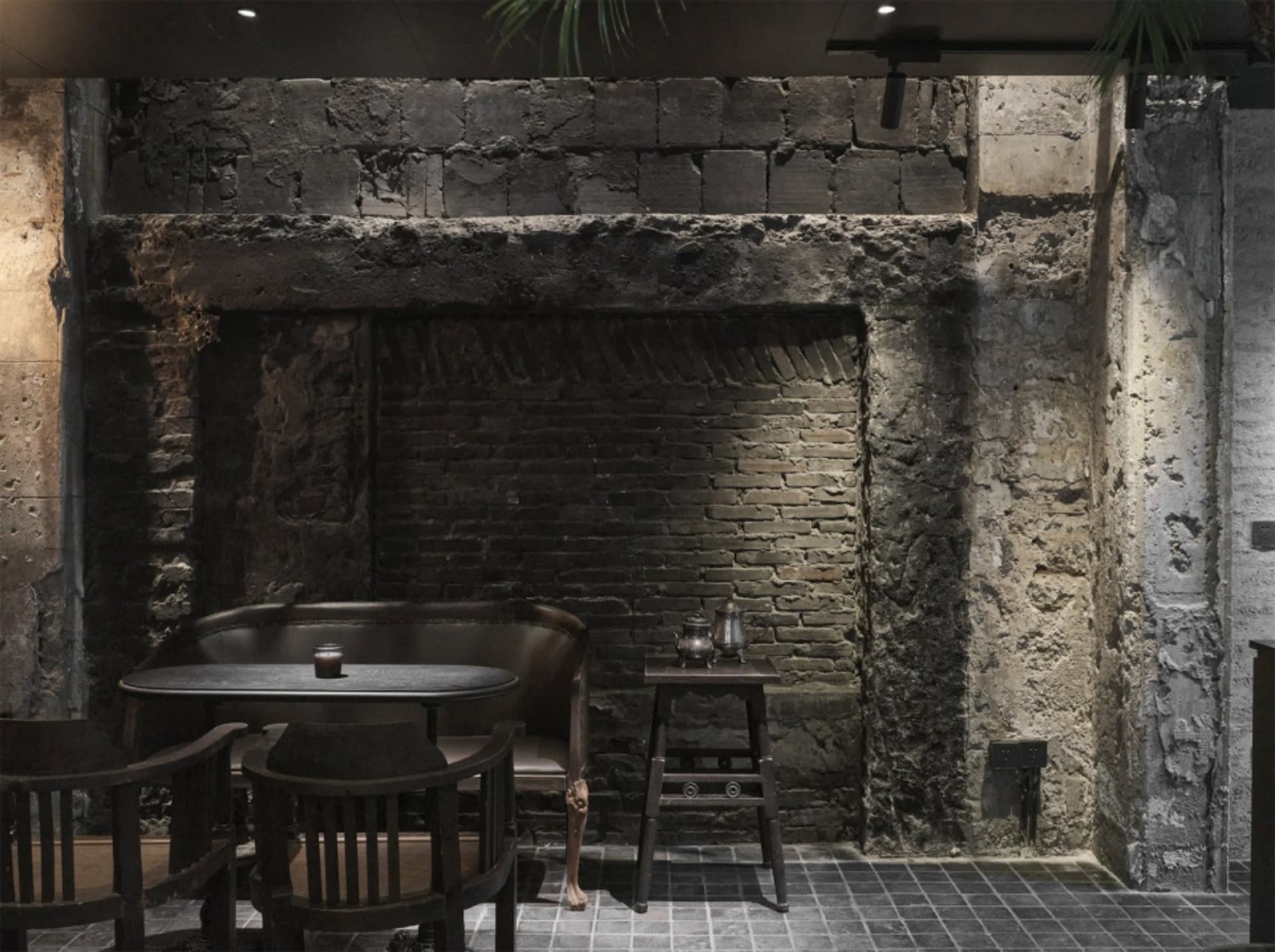 Industrial-style restaurant interior with brick walls and concrete floor